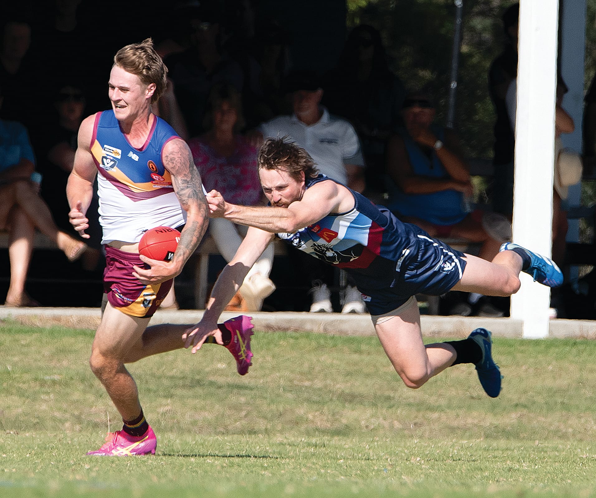 Jack Soroczynski flies at his Dusties opponent in an attempt to win the ball. 
Photos: Anna Carson