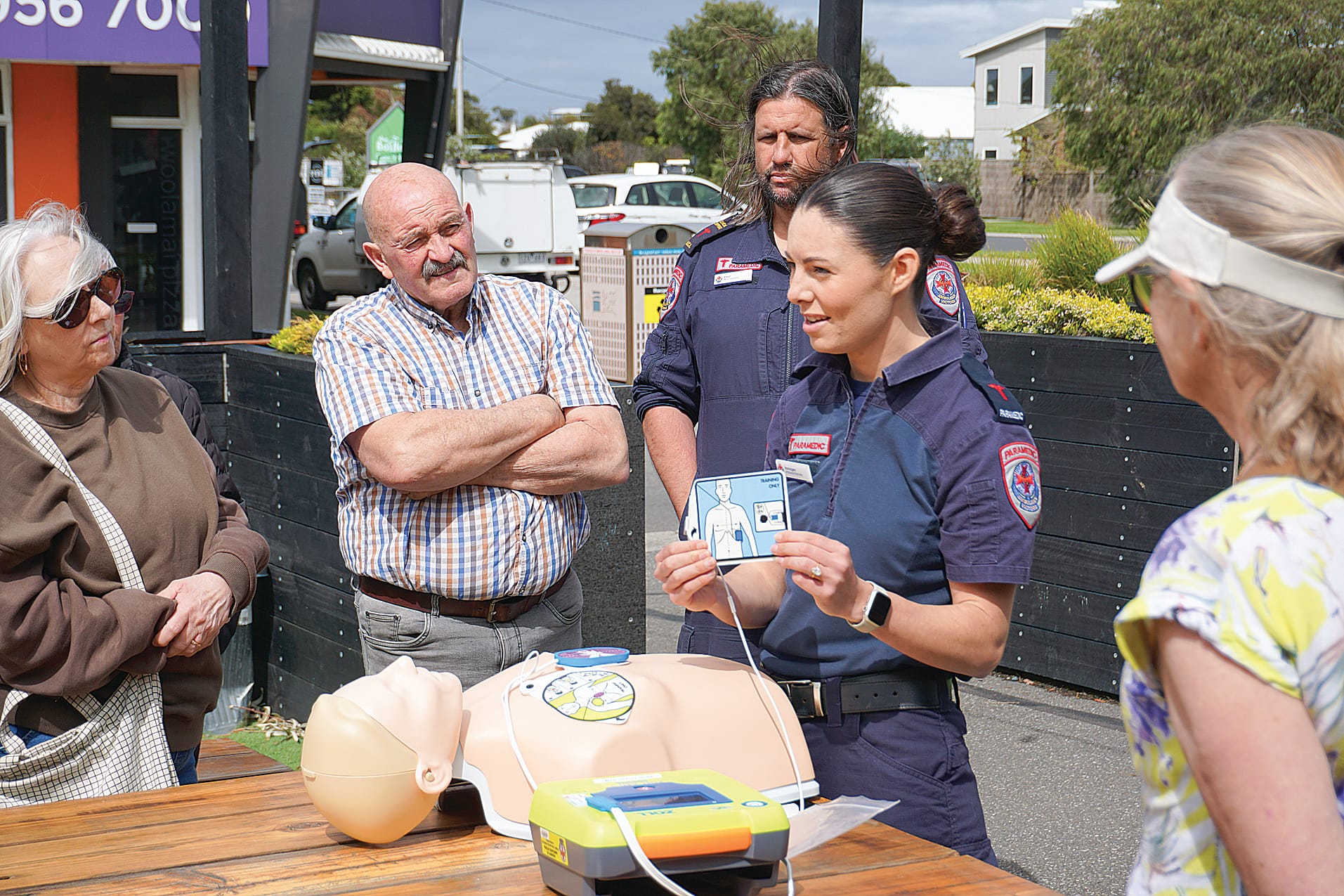 Paramedic Immogen showcases how to use an AED. Ns18_4124
