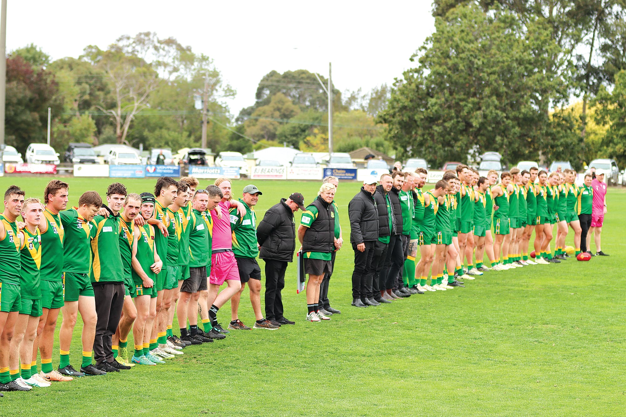 Leongatha players line up for the unfurling of the club’s 2023 Premiership flags. A09_1524