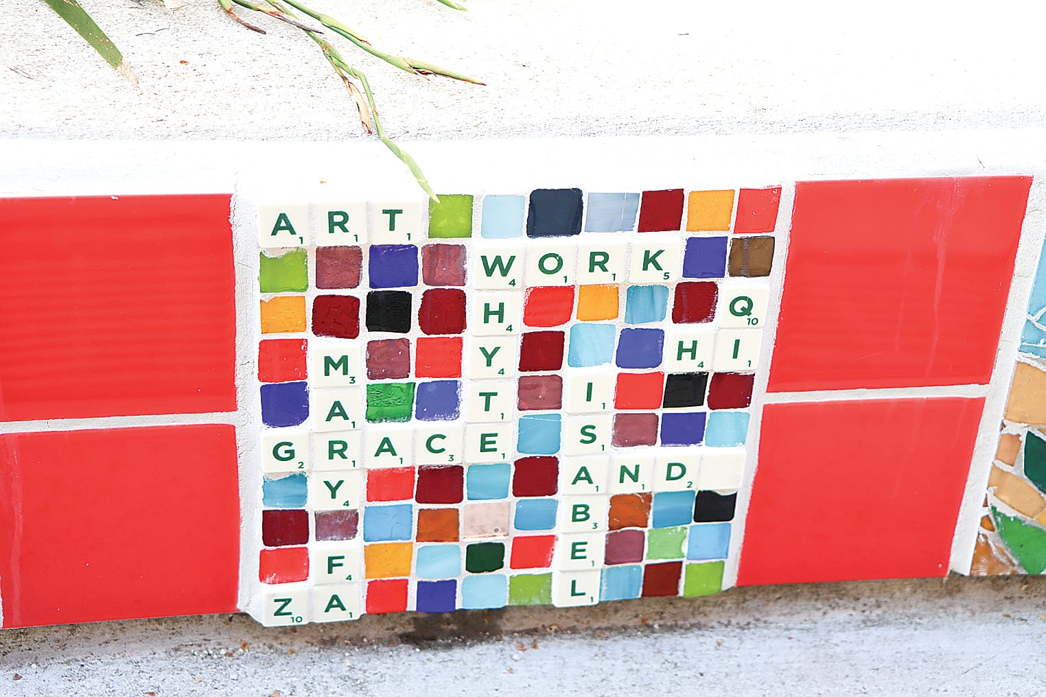 A Scrabble-inspired piece of mosaic work pays tribute to its creators. 