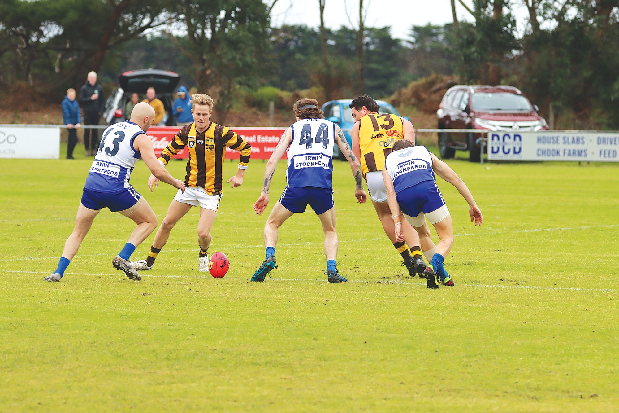 The footy is in dispute as Tarwin’s Daniel Houston, Josh Carmody and Jason Kennedy compete with Hawks Bradley Kimberley and Caiin Iorangi. A14_2724