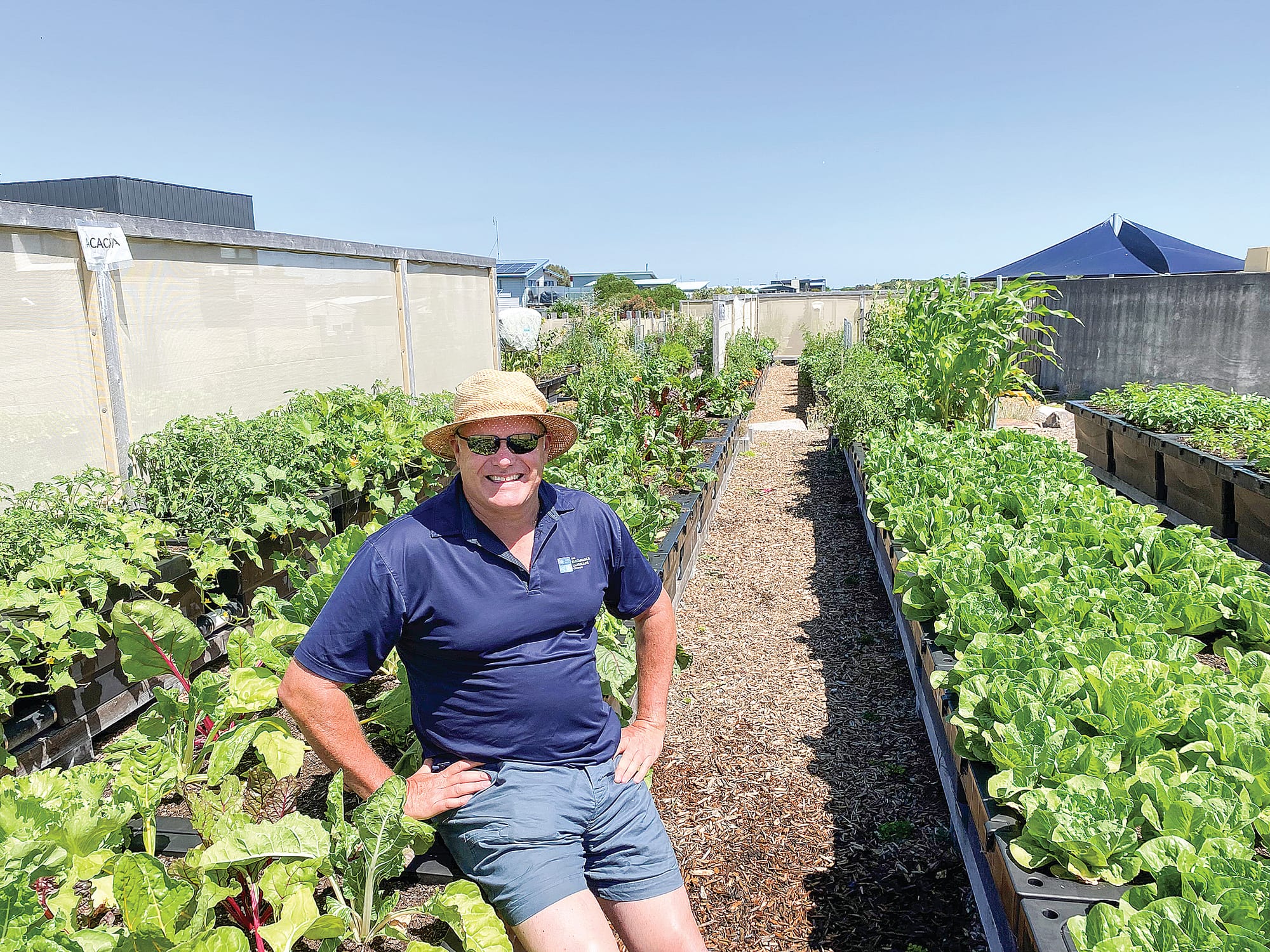The water efficient raised wicking garden beds used in the garden are an Australia invention, according to Australian Ecosystems and TSLC director Brendan Condon, designed for gardeners to sit down while weeding or to provide disability access.