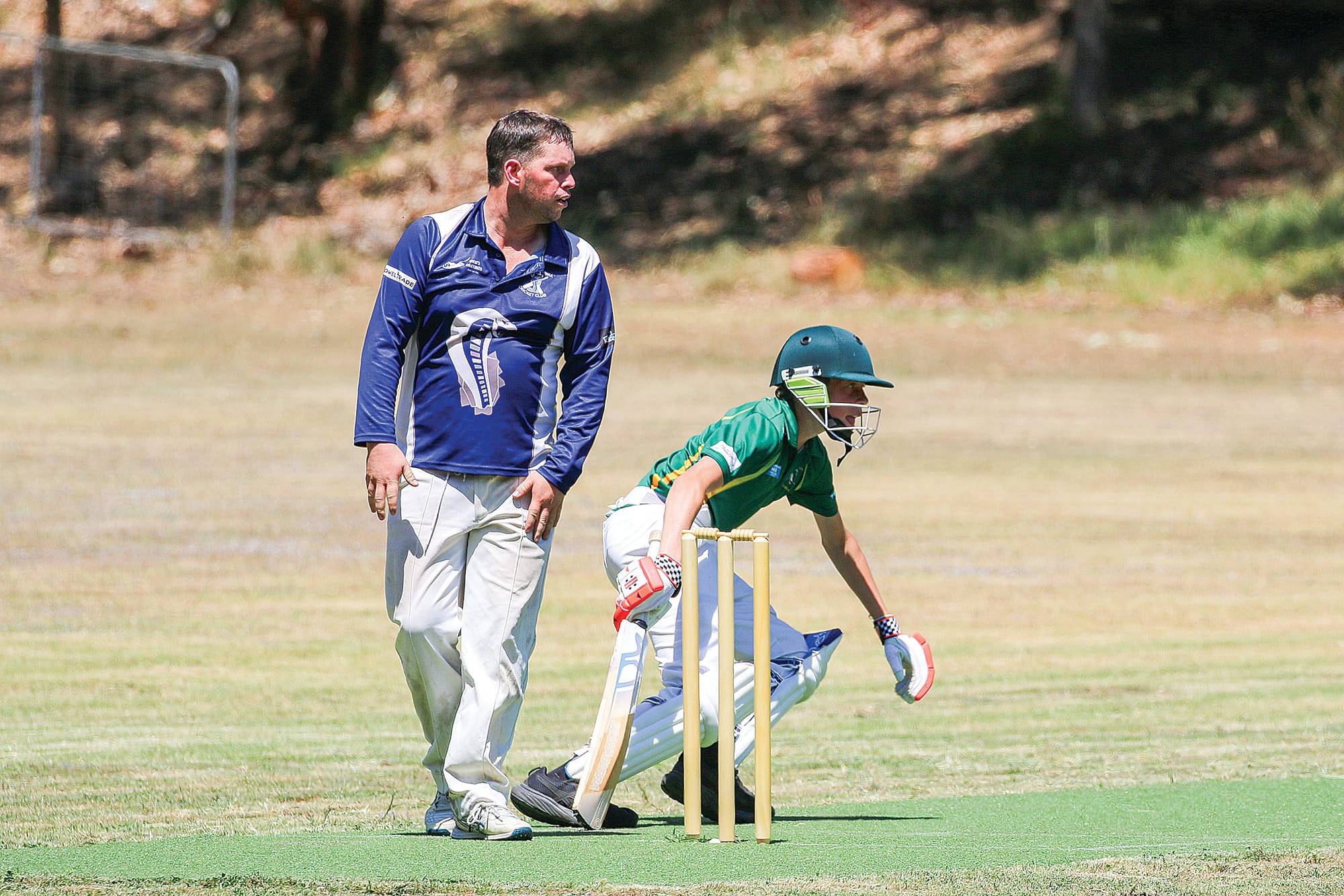 Mitchell Hogarth keeps a close eye on the ball after batting partner Julian Aeschlimann sends it flying. C42_0525