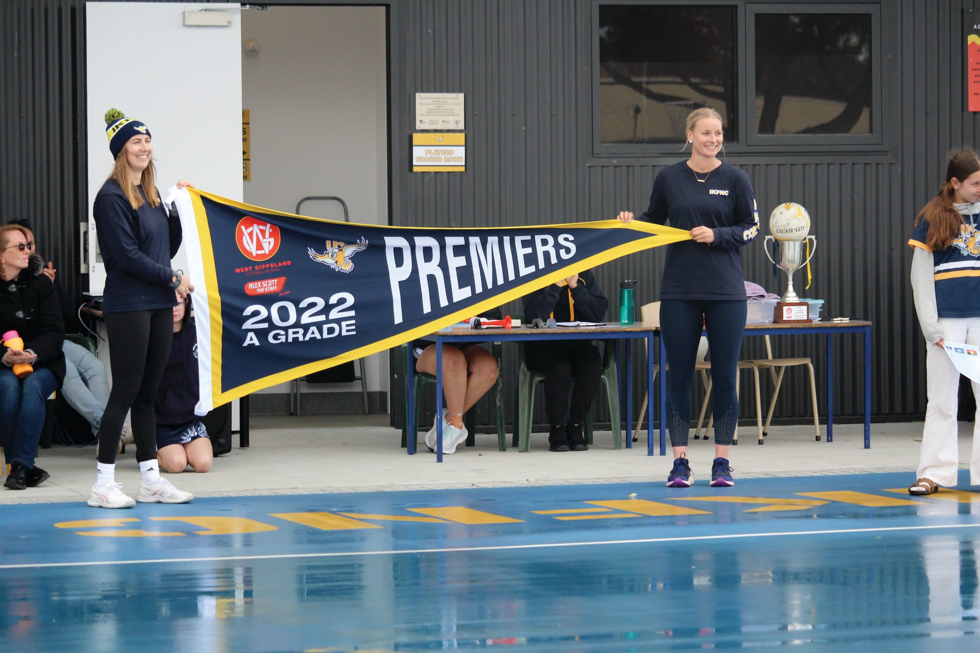 Inverloch Kongwak 2022 premiership players Tayla Robb and Tayla Smith unveiled their premiership flag to kick off their season opener against Nar Nar Goon on Saturday. B08_1523
