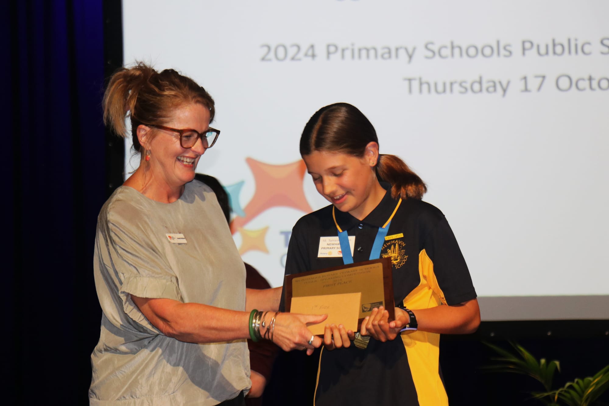 CUC Education Program Coordinator Amanda Mc Mahon presenting Tasmin Watson of Newhaven Primary School with first place at the 2024 Primary Schools Public Speaking Competition. 