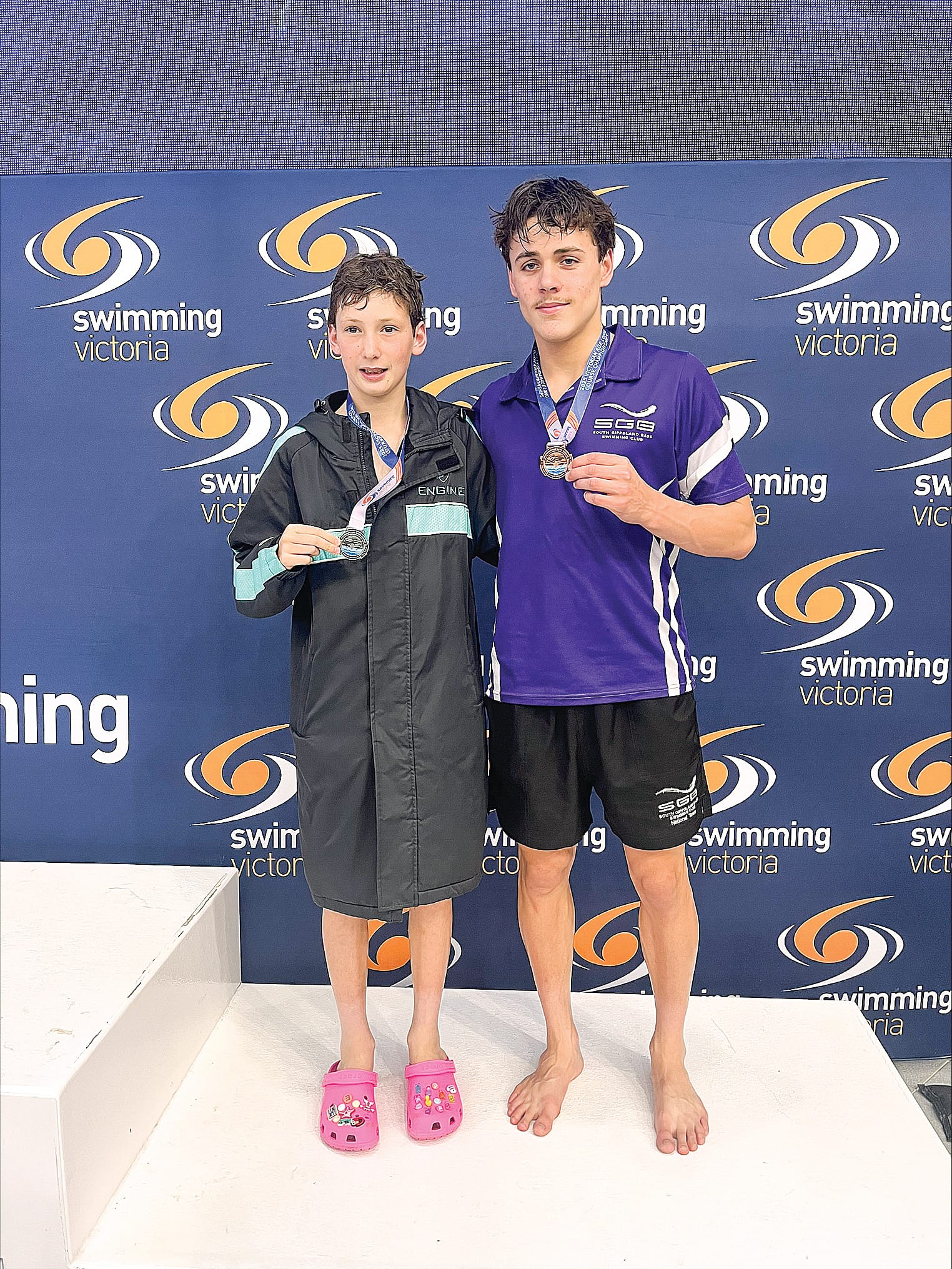 Levi and Zac celebrate their medals