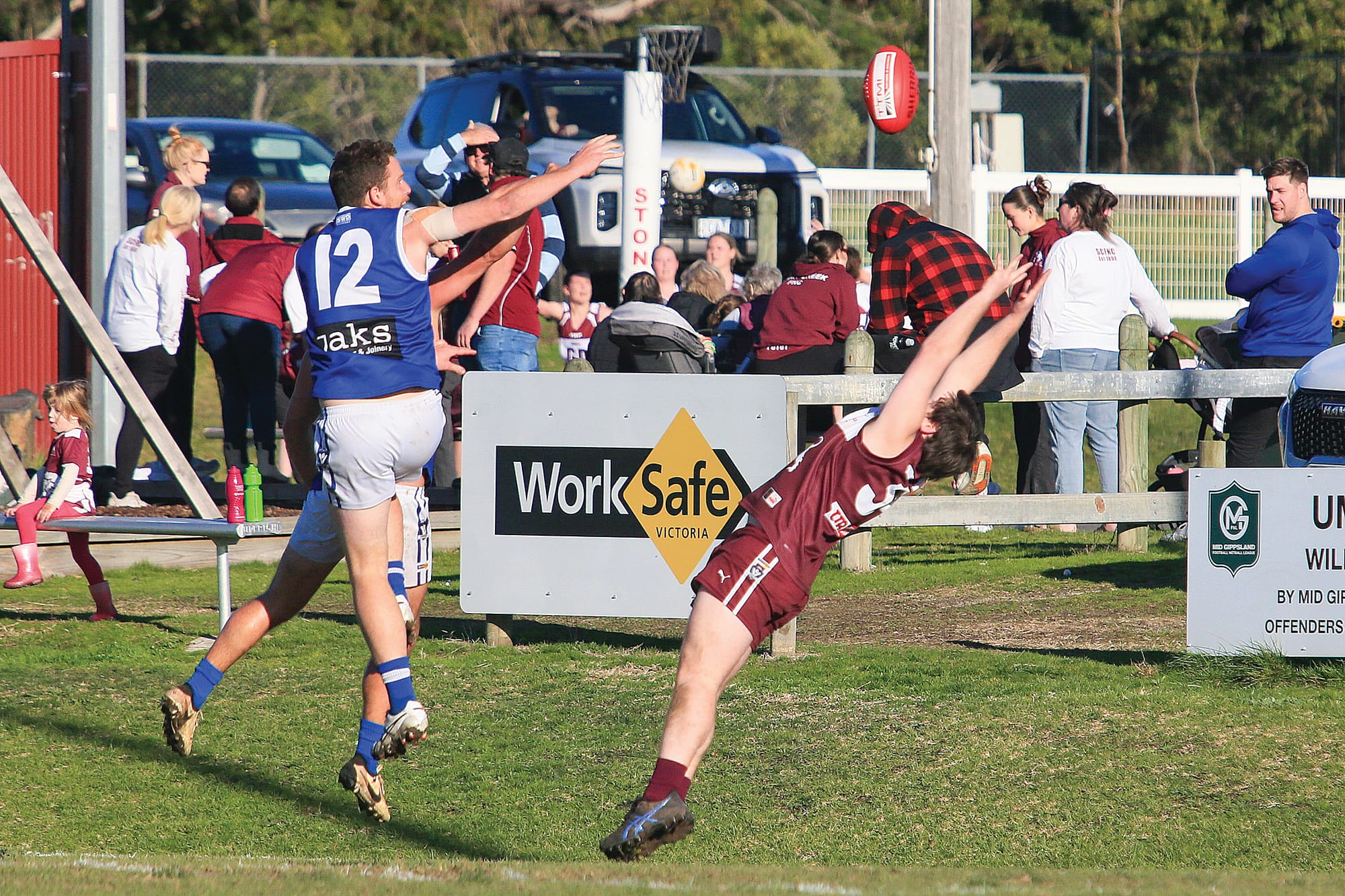 Desperate defence as a Stony Creek player flies backwards with the flight to spoil a Thorpdale attack. Photos: G.S. Bruning.