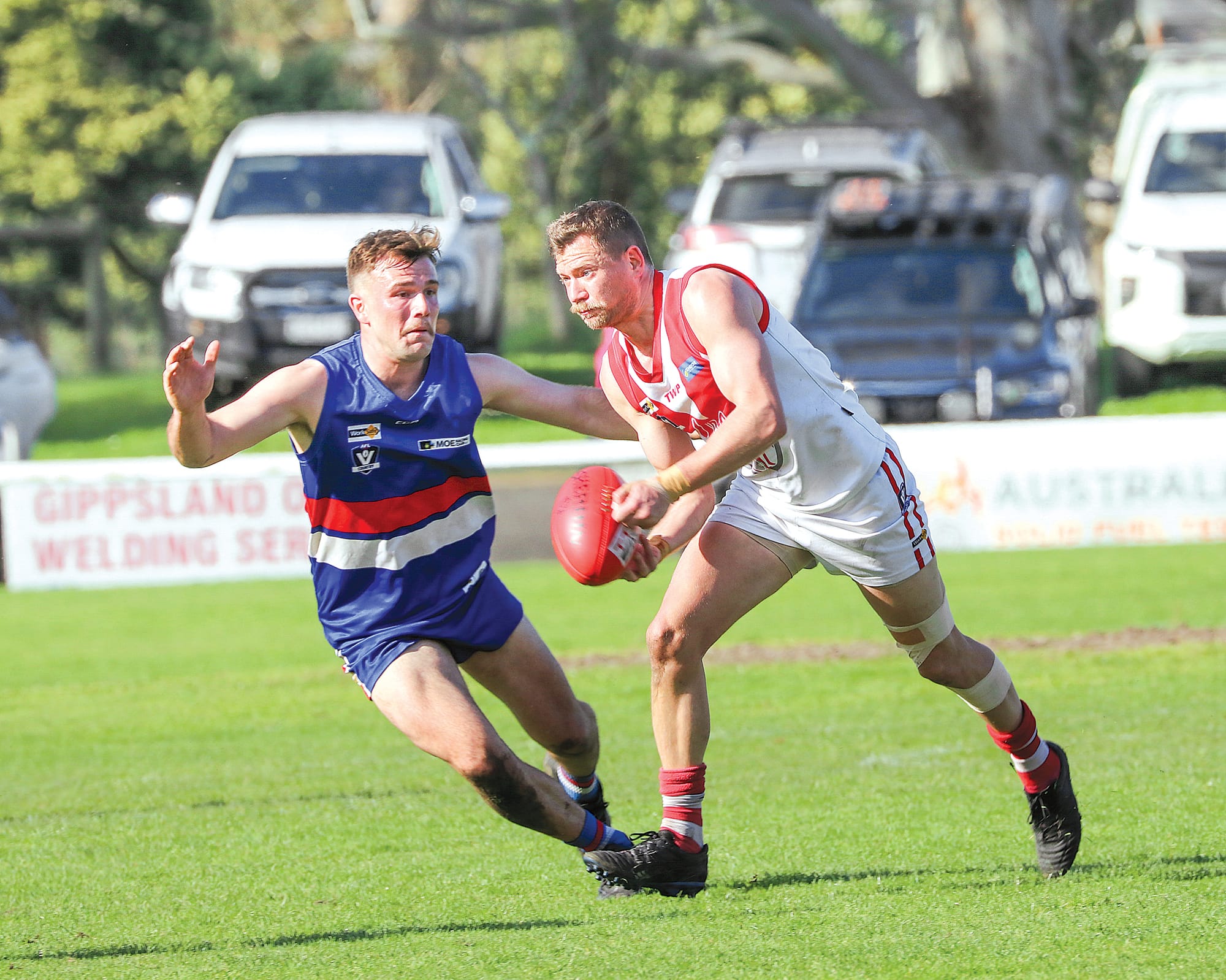 Willem Voorham handballs under pressure from Newborough. Z16_3623