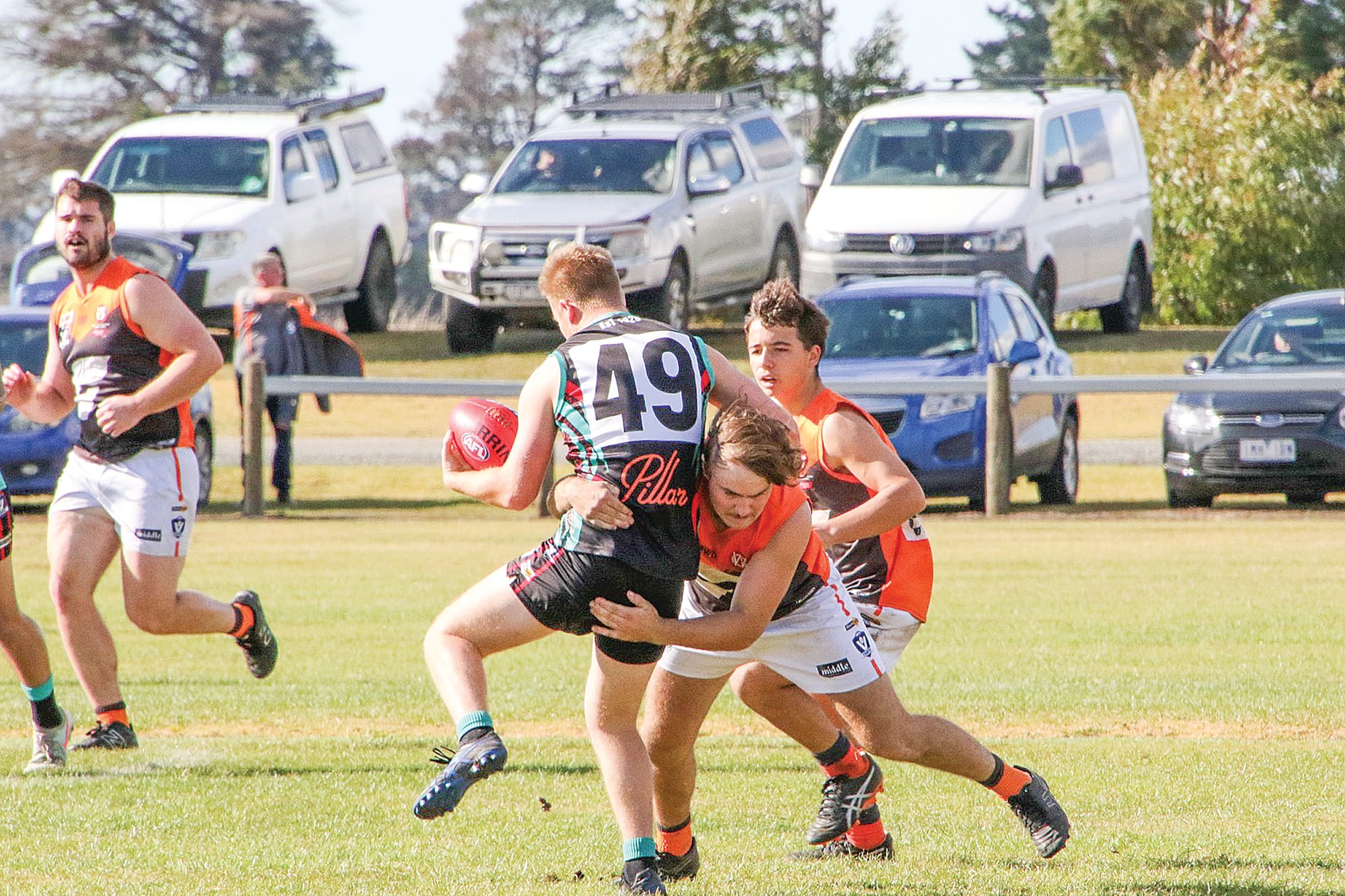 Good tackle by Korumburra against Cora Lyn. Photo: NSM Images. 