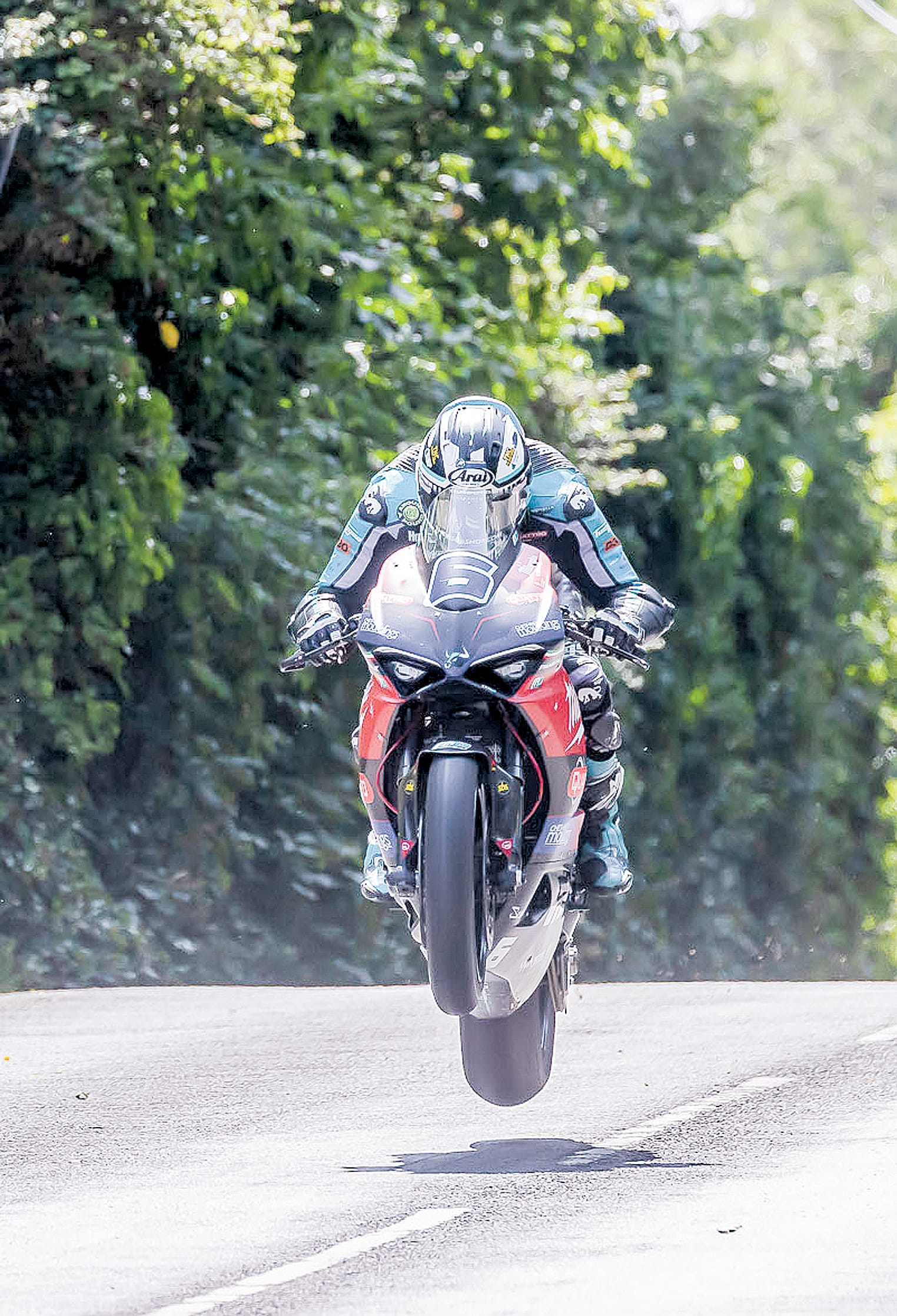 King of the Mountain, Michael Dunlop on the 955 Ducati at Ballacrye Jump heading to victory in the Supersport TT. Photography3922