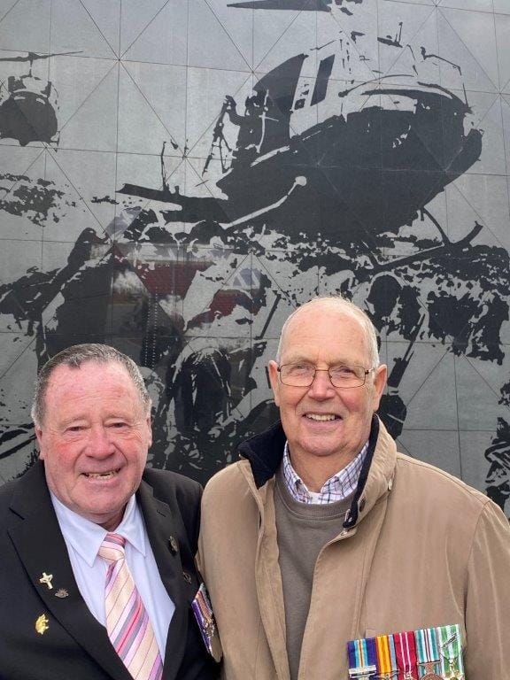 Former Wonthaggi resident, Stan Whitford, right, with one of his 5 Platoon, B Company, 7RAR mates,&nbsp;Neal Hasted of Ipswich in Qld&nbsp;featured in the Australian Vietnam Forces National Memorial that was the centrepiece of last Friday’s 50th anniversary of Australia’s withdrawal from the Vietnam War. Above them, etched into the memorial wall is the image of Leongatha’s Rob Fennell.