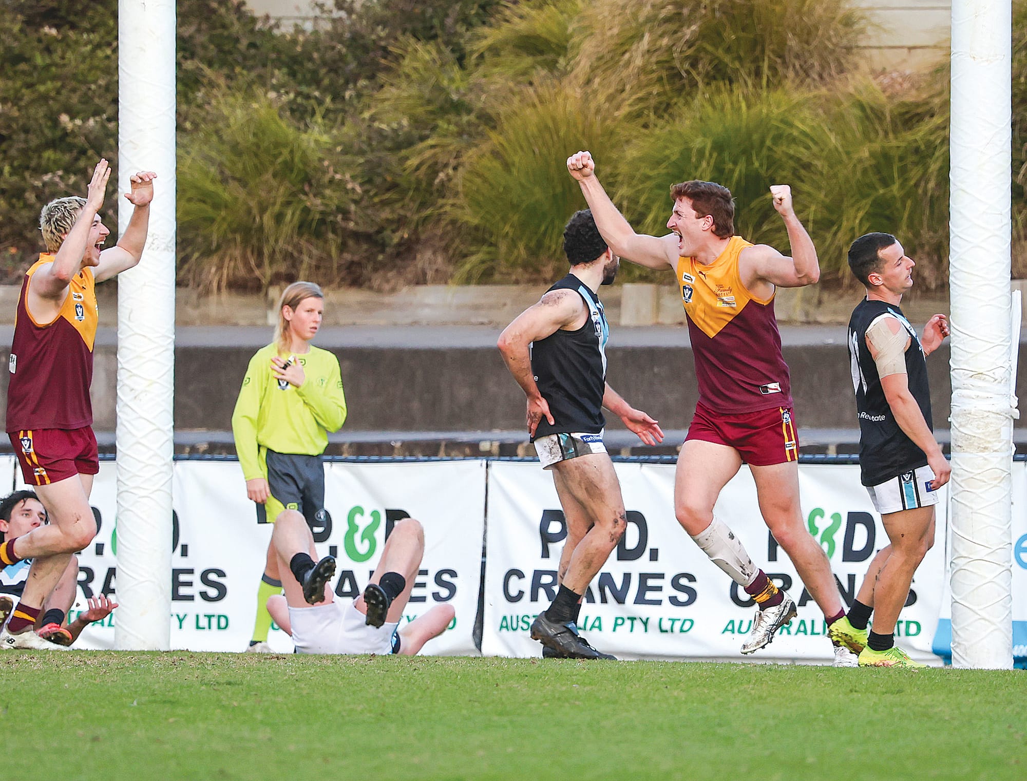 That’s it! Big Drouin ruckman Denver Lund throws his boot at a bouncing ball at a crucial stage in the last quarter.
