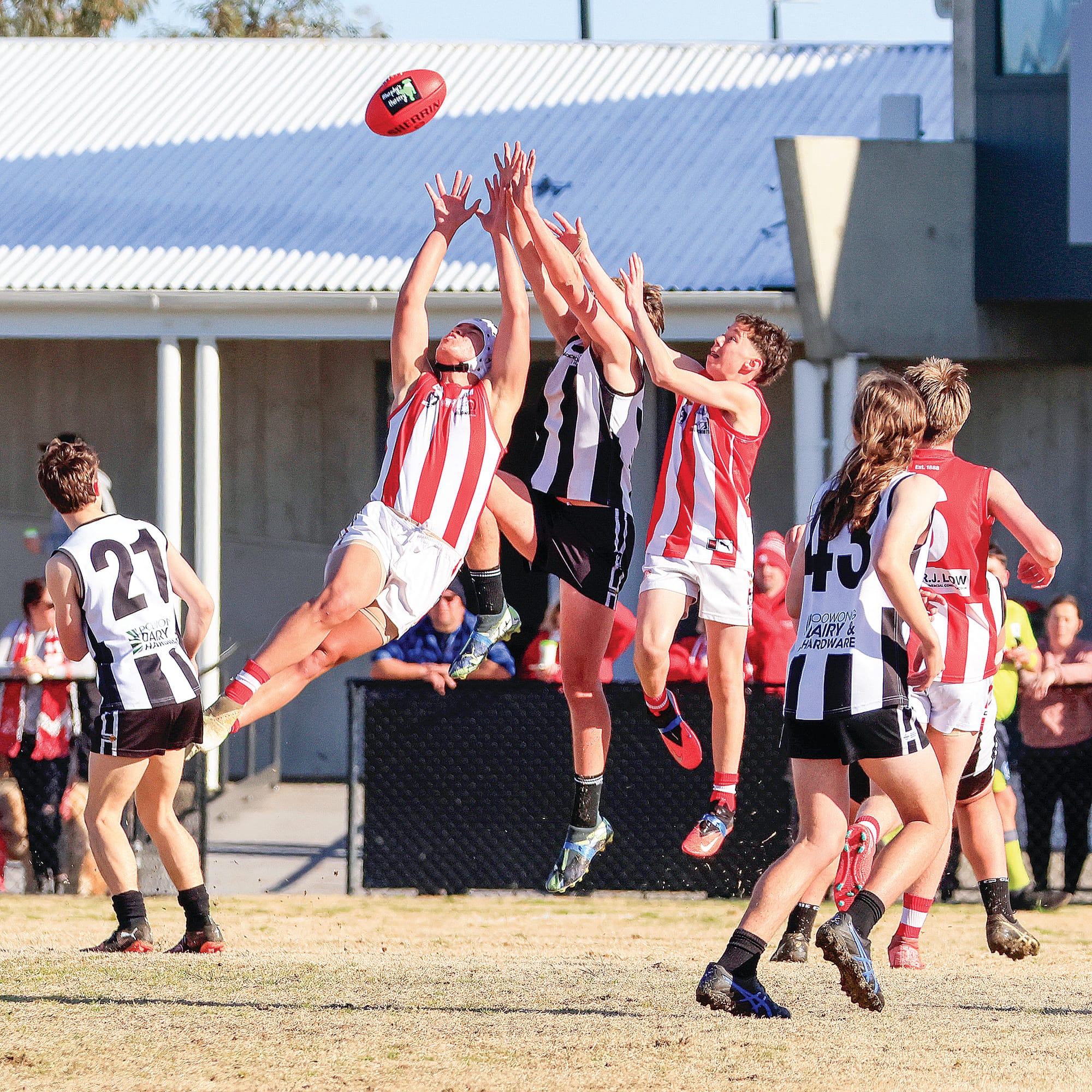 George Edwards leaps for the mark against his Trafalgar Bloods opponent. Photos: Jeff Tull. 