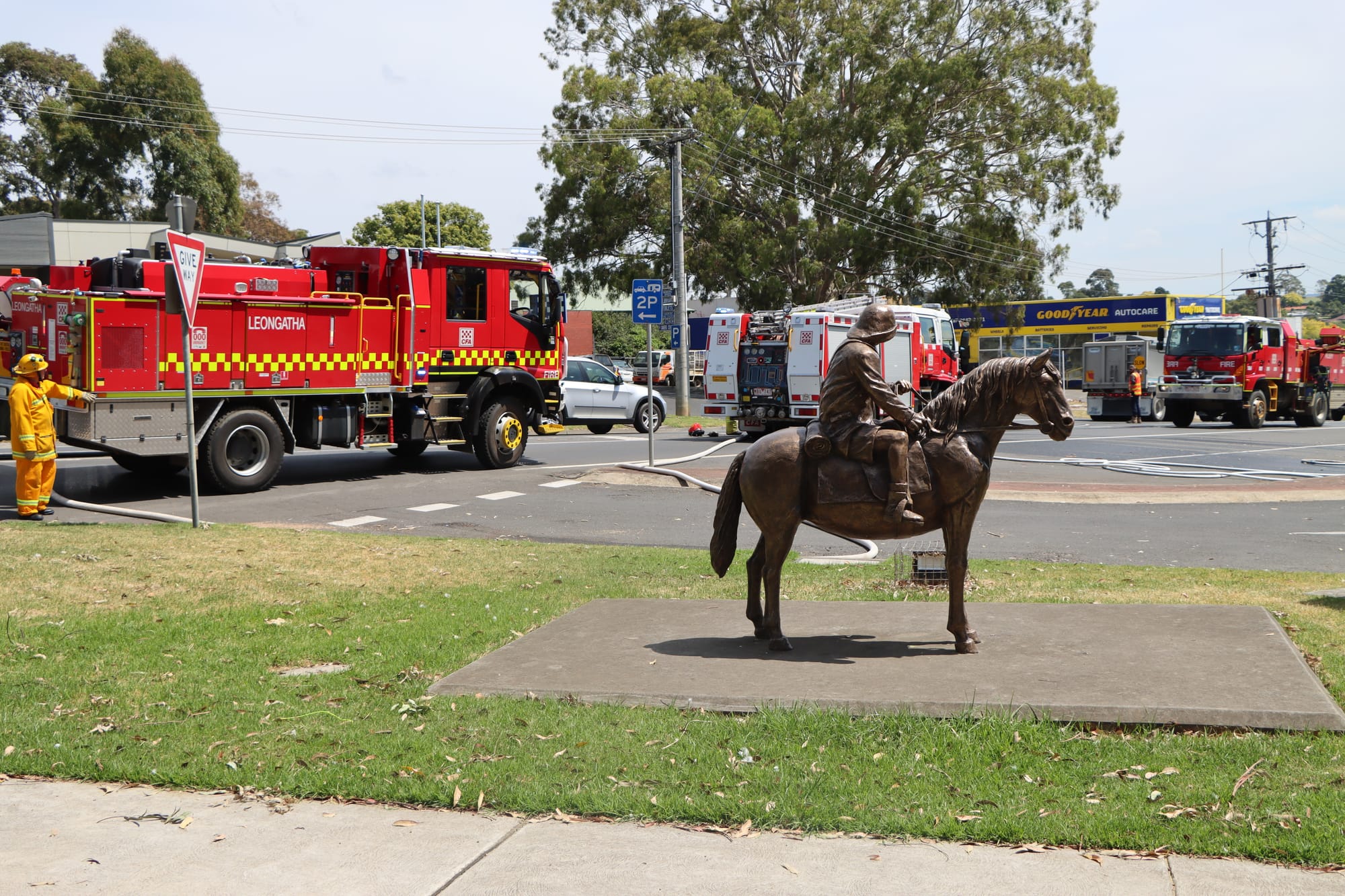 Lennie Gwyther and Ginger Mick watch proceedings in Leongatha after the truck fire was brought under control.