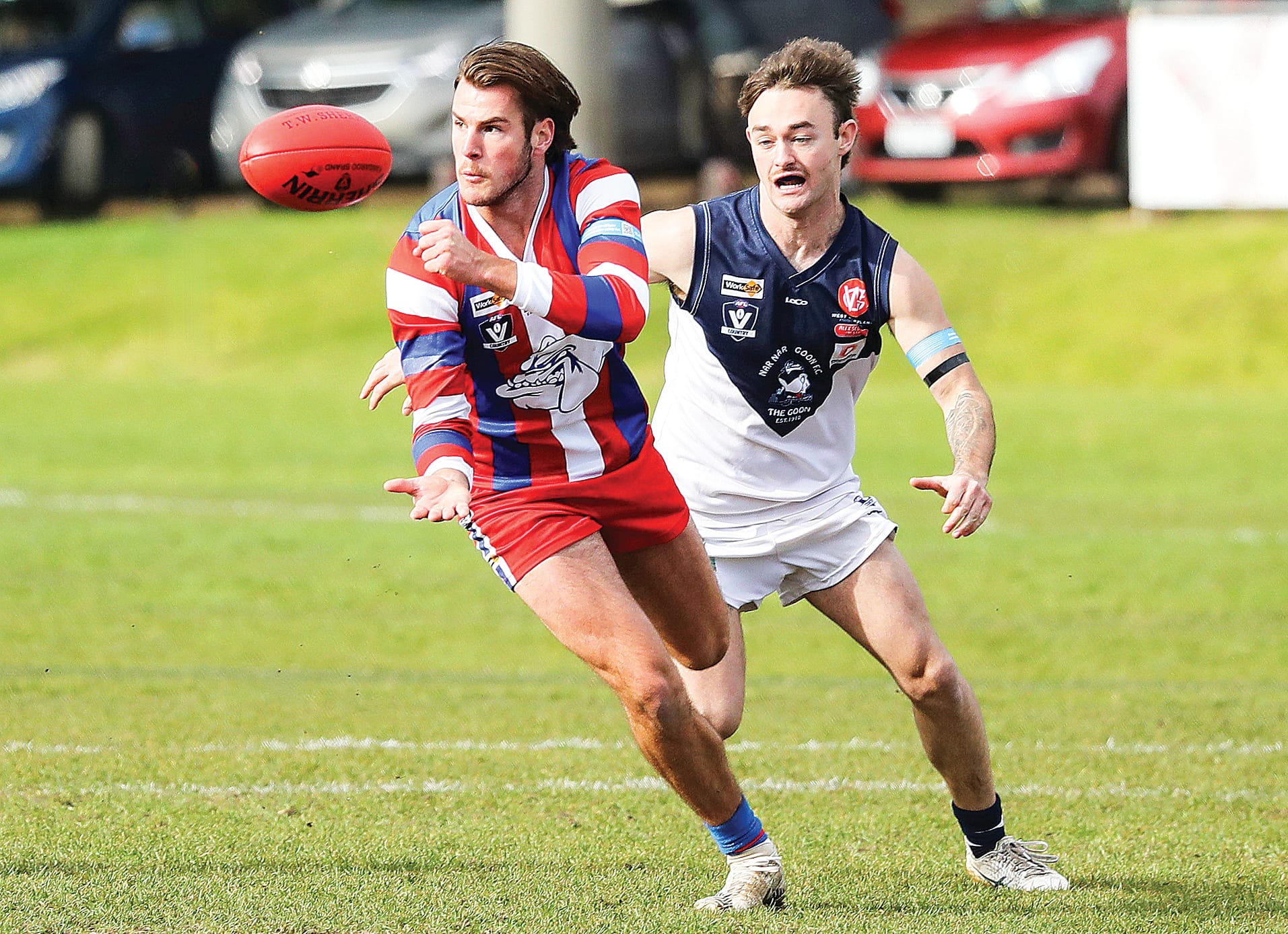 Levi Robinson makes a pass as The Goon closes in.