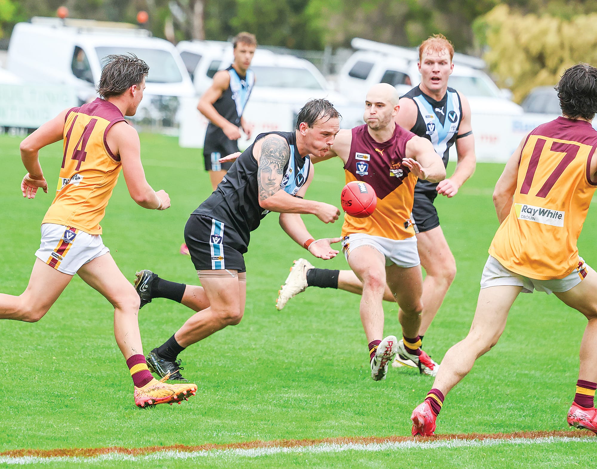Reeve Moresco gets his handpass away under plenty of pressure on the Wonthaggi Power backline with Kyle Reid in support.