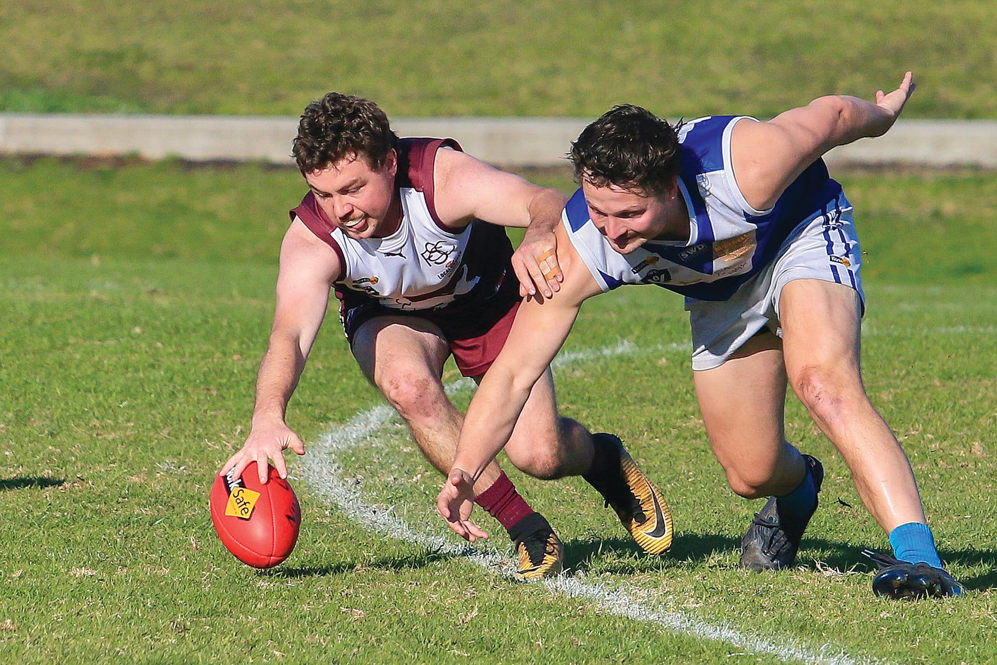 Stony Creek and Thorpdale opponents dive headfirst into the contest during a fierce midfield battle. 