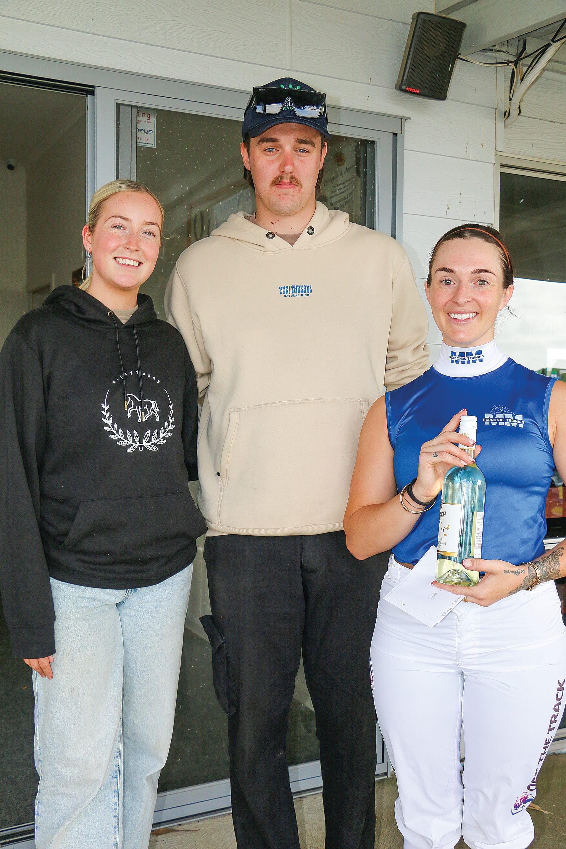 Tipsy Pony Trophy Race Handicap sponsors Lara Taylor and Cody Hogg with winning jockey Maddison Morris.