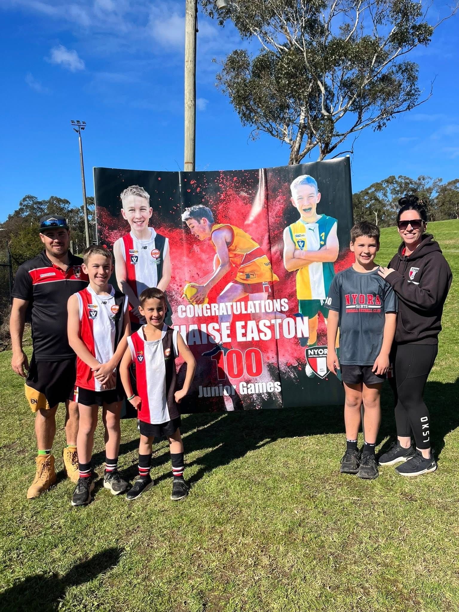 Chaise Easton of Nyora Football Netball Club celebrates 100 games.