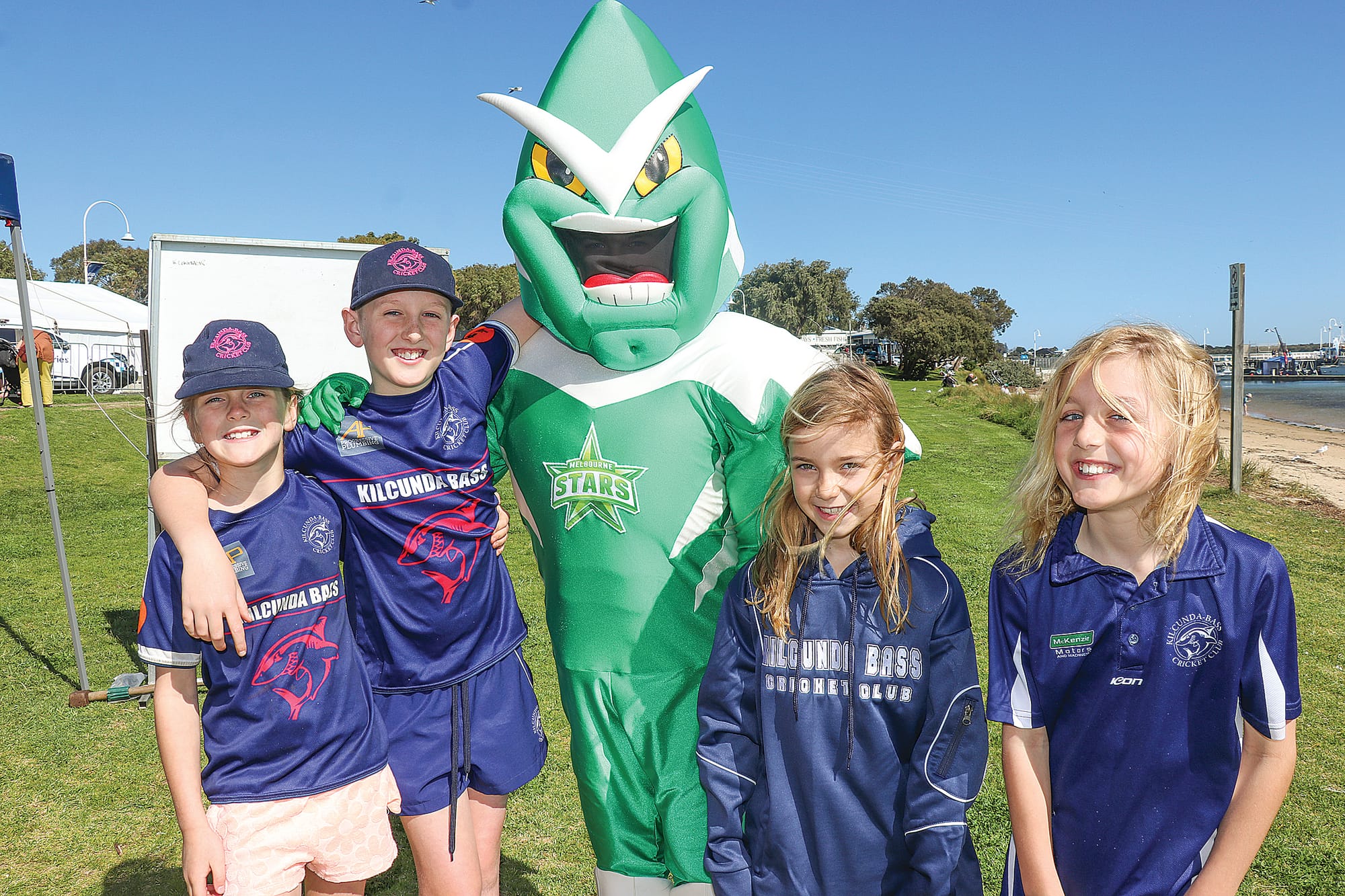 Violet, Charlie, Indi, and Jack of the Kilcunda Bass Cricket Club managed the annual deckie race at the Tidal Seafood Festival with mascot Star Man. Z11_3823 