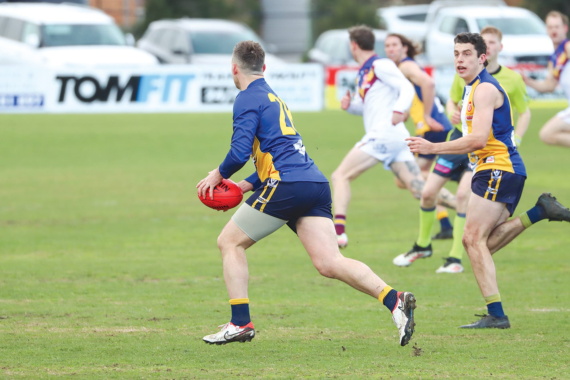 Toby Mahoney has the footy for Inverloch Kongwak early in its 15-point loss to Warragul Industrials. A47_3325