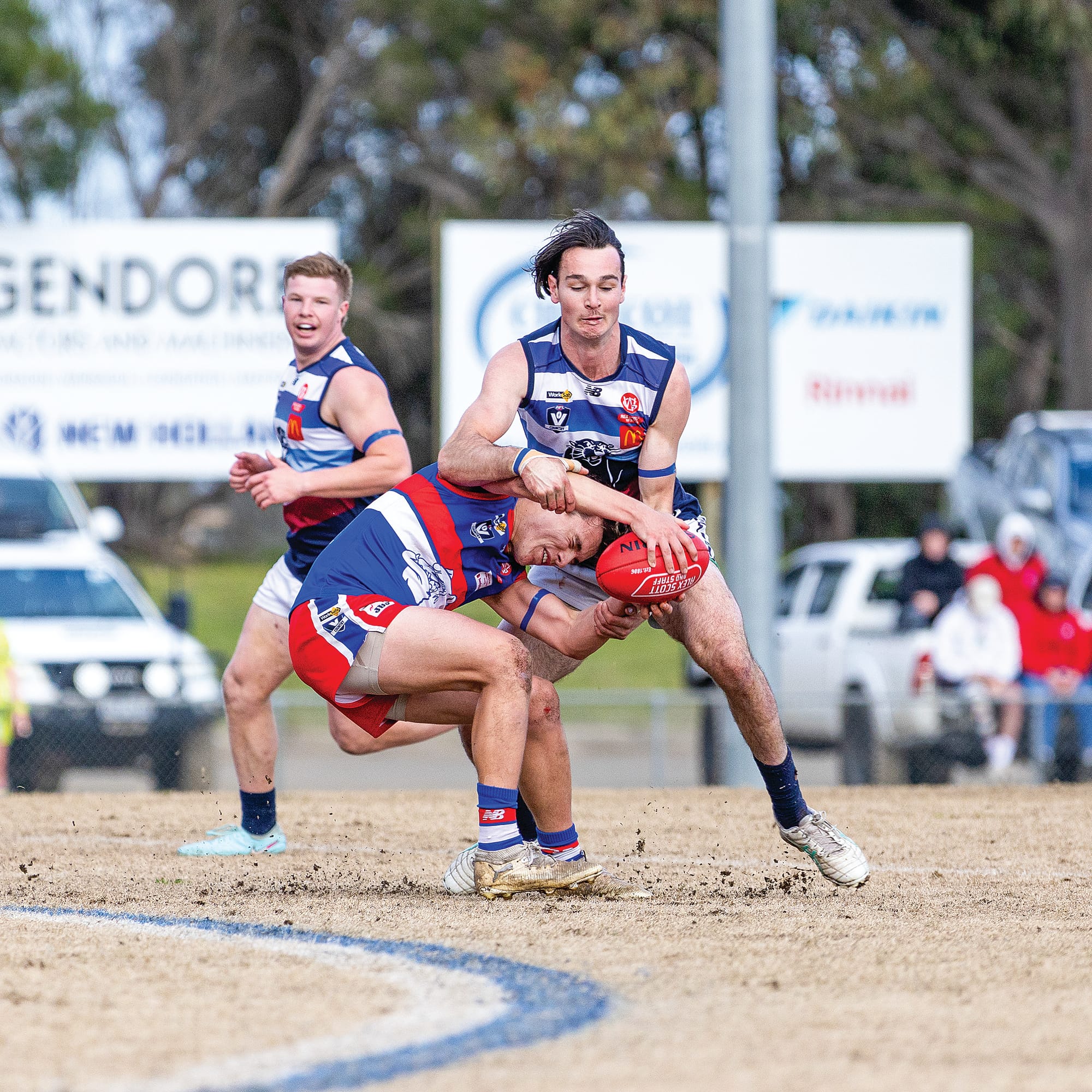 Dean McRae uses his height to advantage to lock the ball in. 