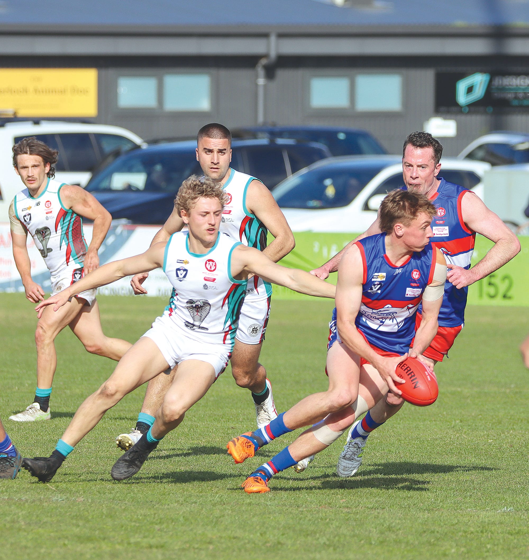 Phillip Island’s best player on Sunday Max Walton looks for an option as he bursts clear of his Cora Lynn opponent. A31_3625