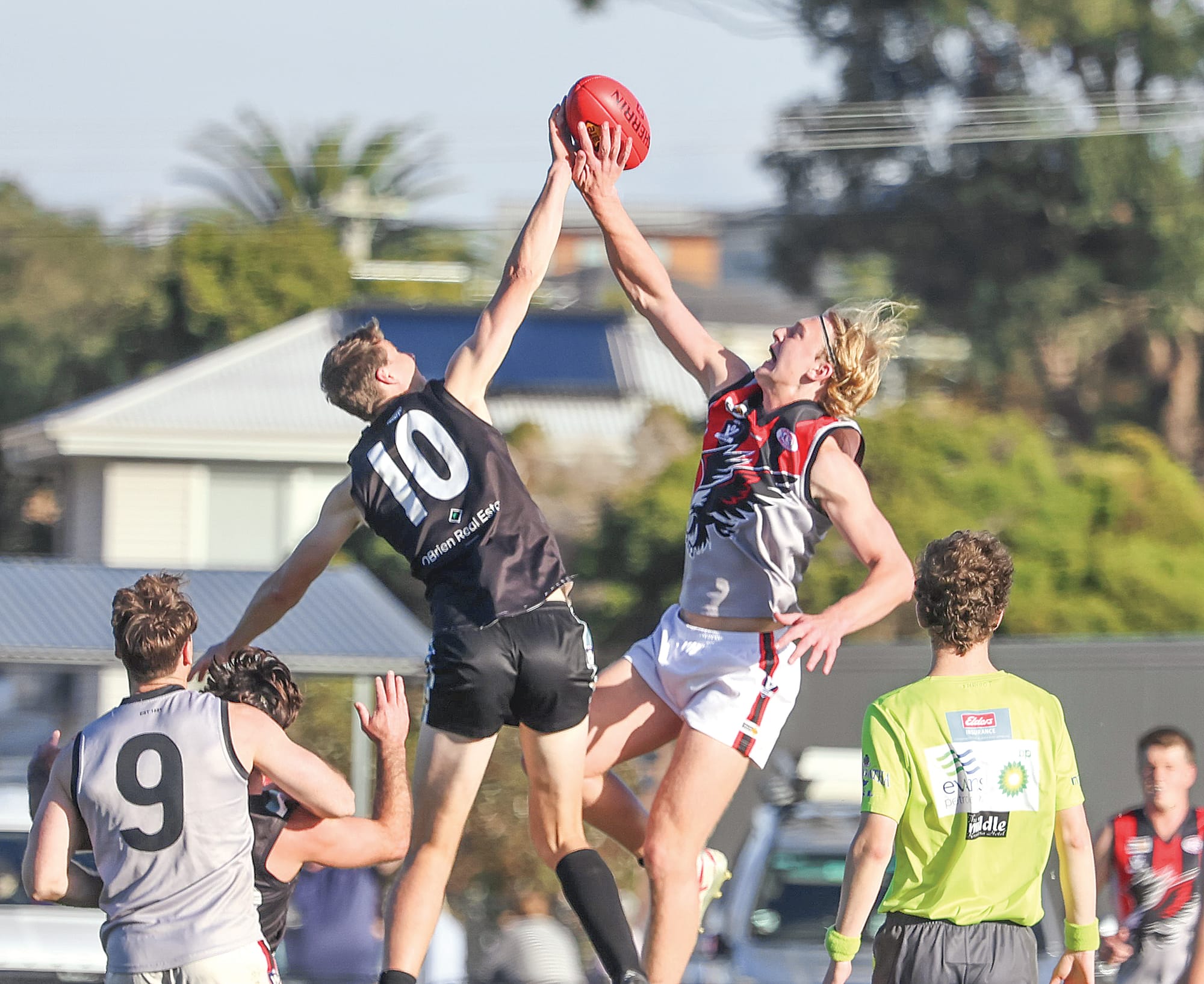 And the big men fly during a close contest between Wonthaggi and Maffra on Saturday where Toma Huther led the way for the Power in the ruck.