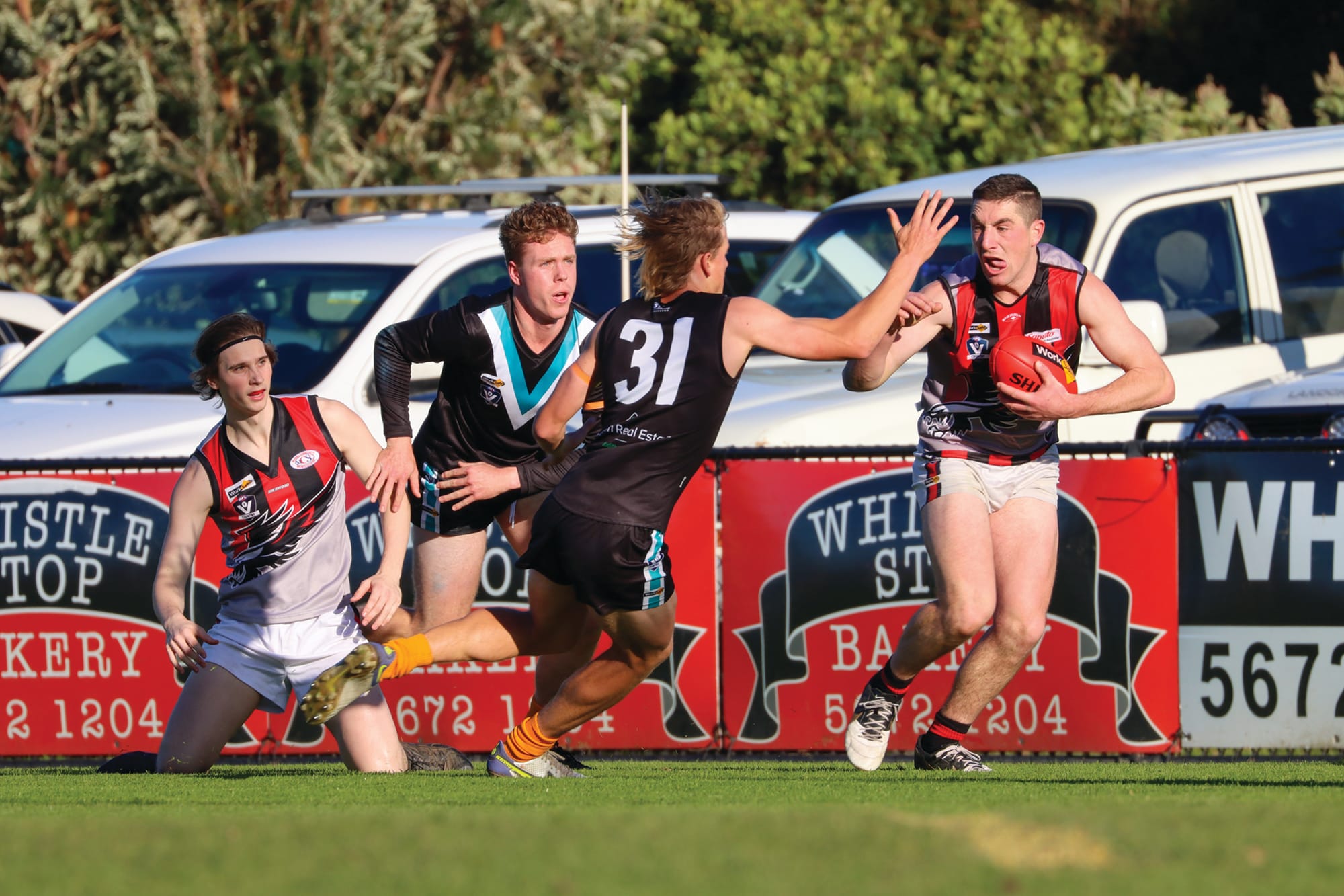 Jack Hutchinson applies pressure to his Maffra opponent.