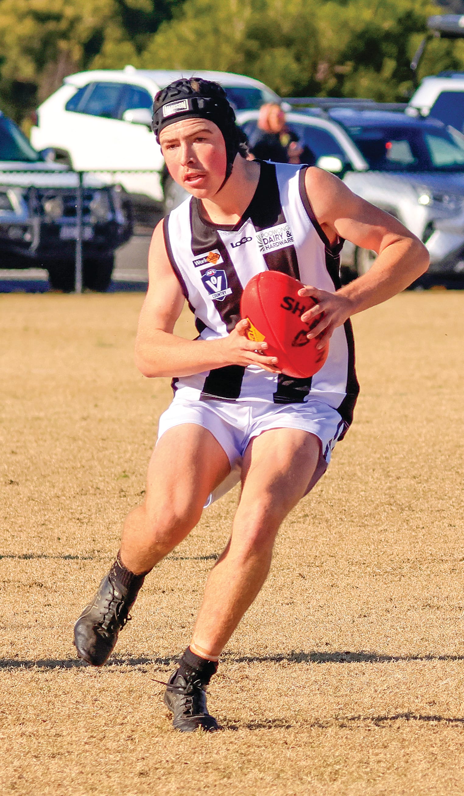 Jett Blackwood moves around his opponents in the Poowong U18s. Photo: Jeff Tull.