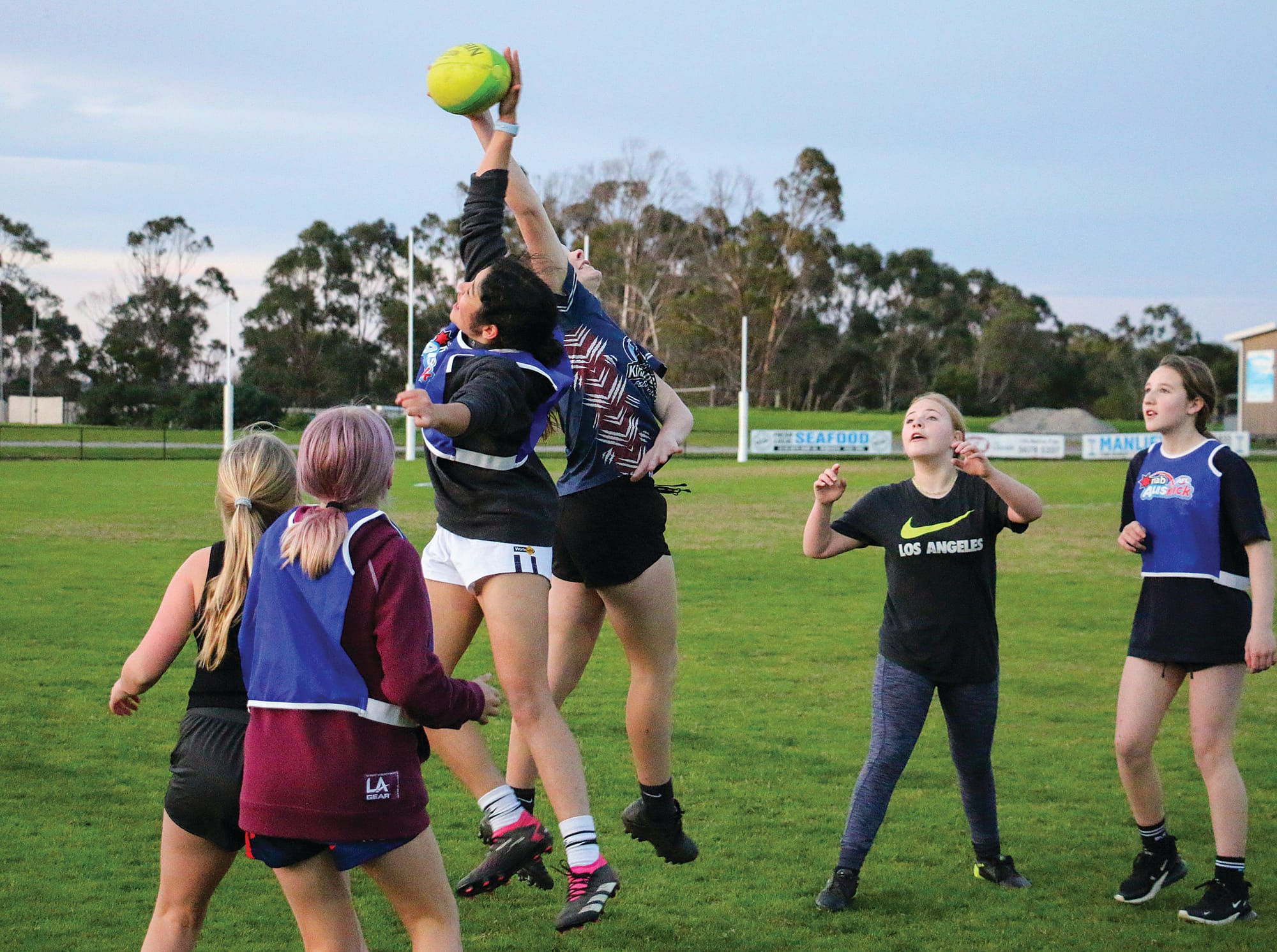 Jaylah Loughridge and Beth Grenness in action during a drill at the junior girls’ footy training on Friday. 