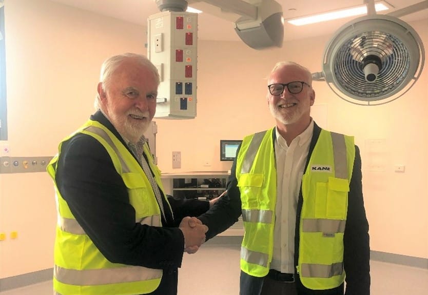 Outgoing Bass Coast Health Board Chair Don Paproth (left) wishes incoming chair Ian Thompson well in a new theatre in the Wonthaggi Hospital Expansion.