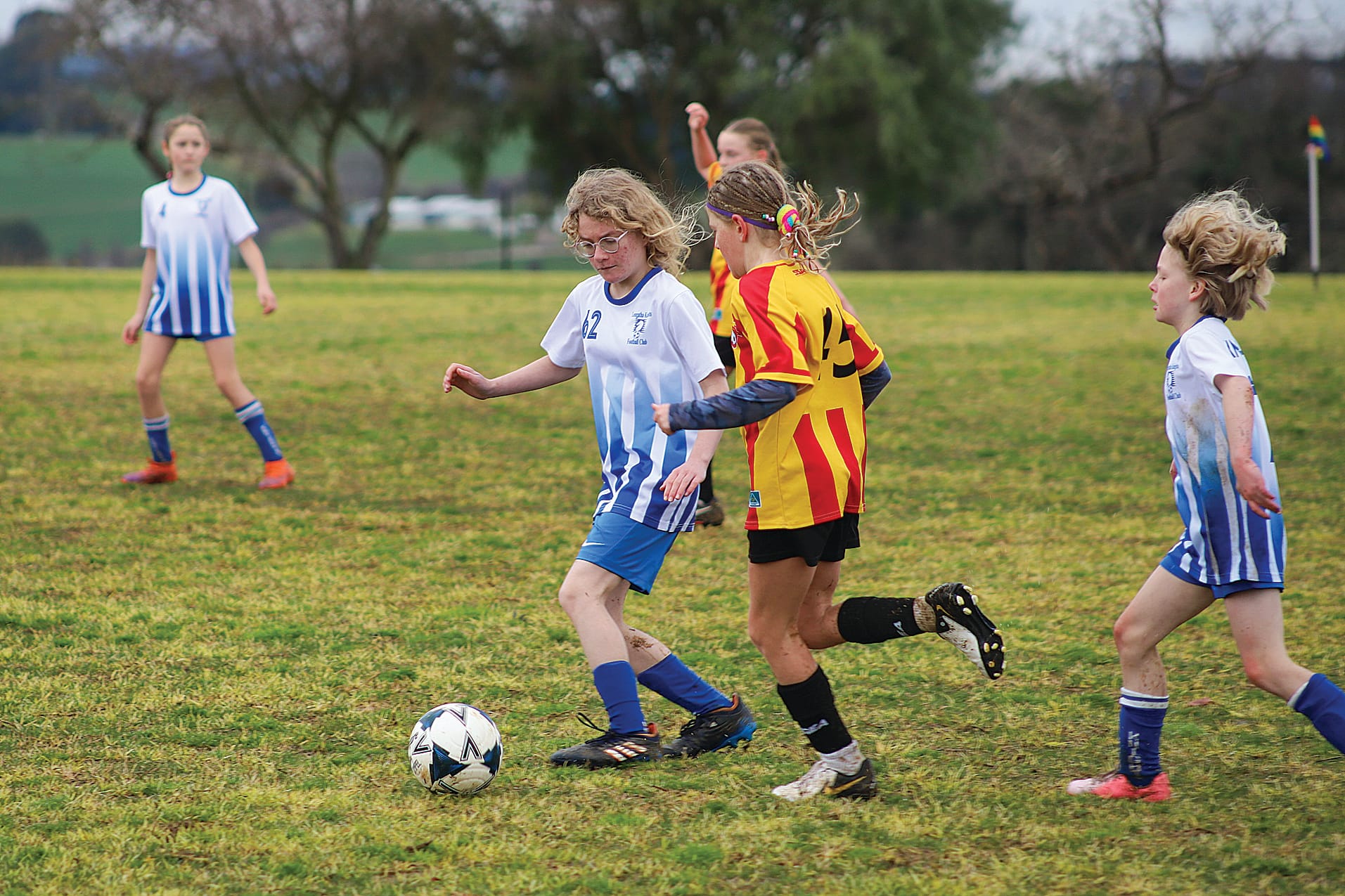 Leongatha Knights FC’s Maddy challenges her Inverloch opponent for the ball. 