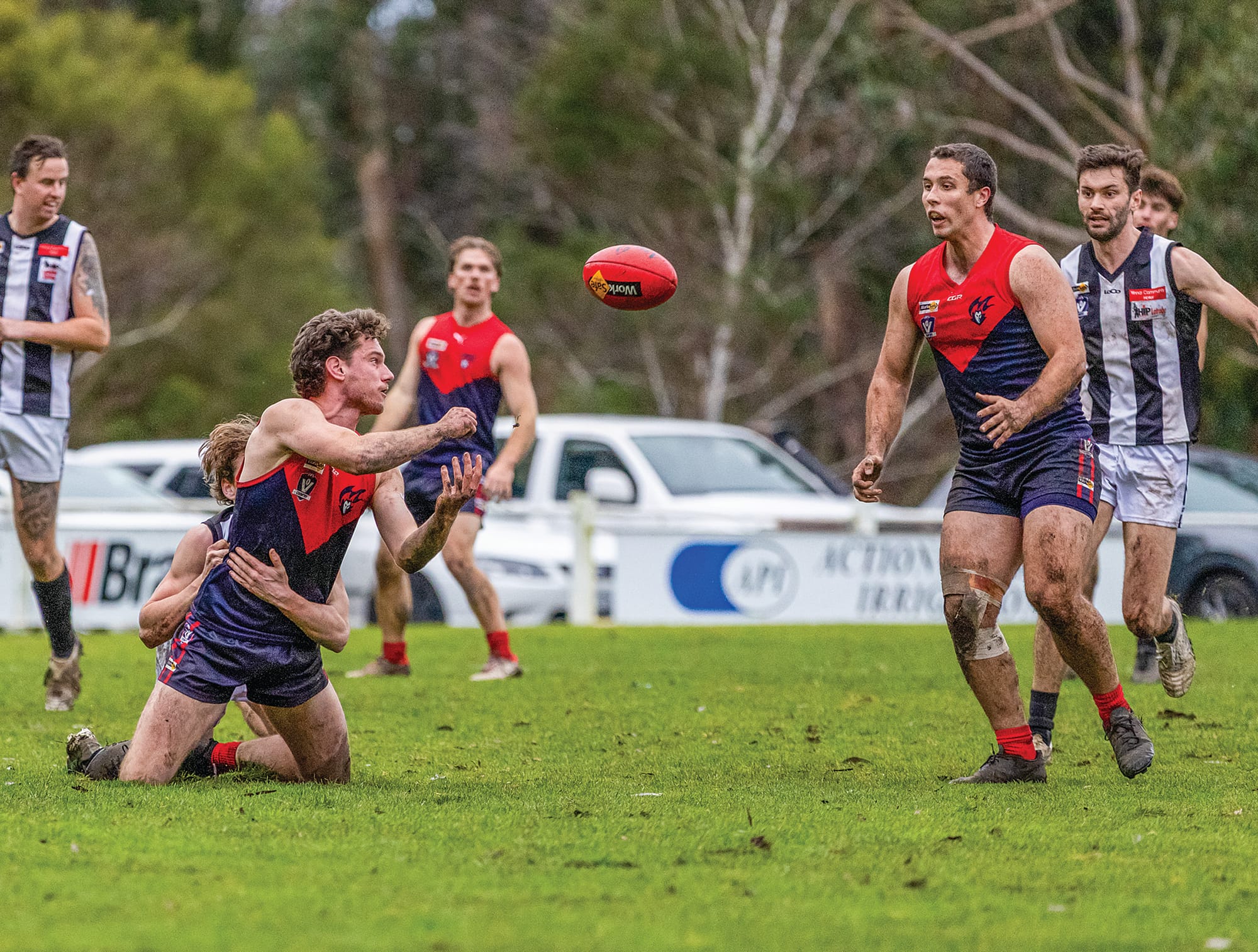 Joel Leeden handballs the ball out from the tackle. Photo: Bec Casey Sports Photography. 