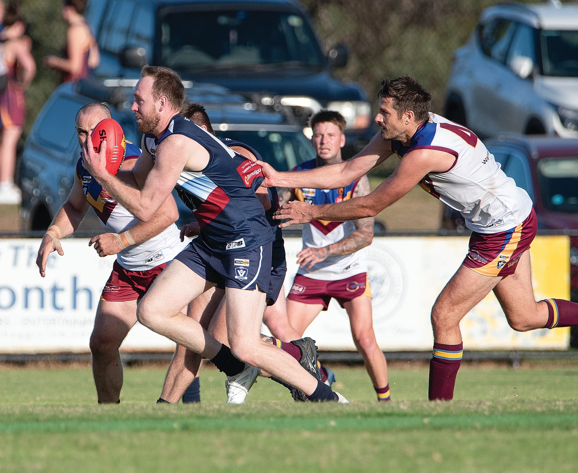 Dale Gawley tries to clear the ball for Kilcunda Bass.
Photos: Anna Carson