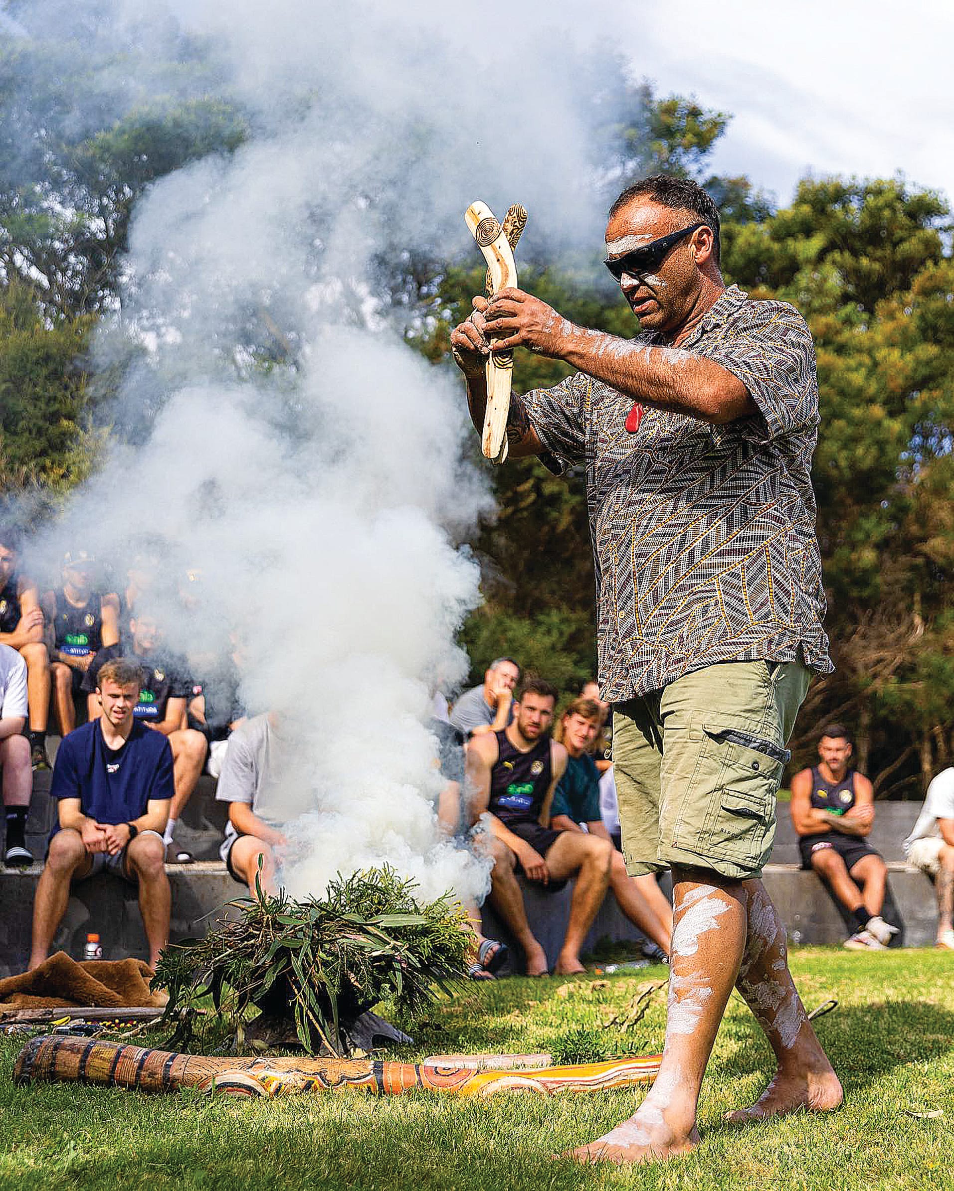 Boonwurrung Country representative Steve Parker gets a good fire going during his Welcome to Country for the Richmond Football Club at Inverloch last week.
