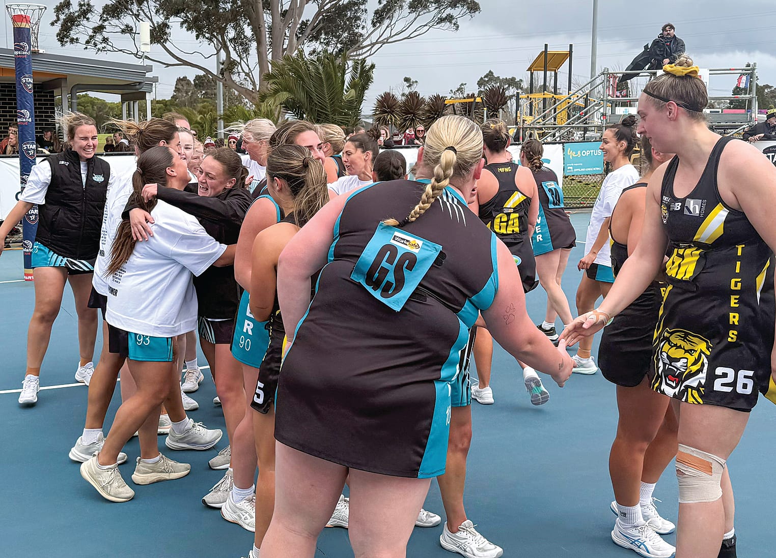 The players of both C Grade grand final teams, Wonthaggi and Morwell get together after the game.