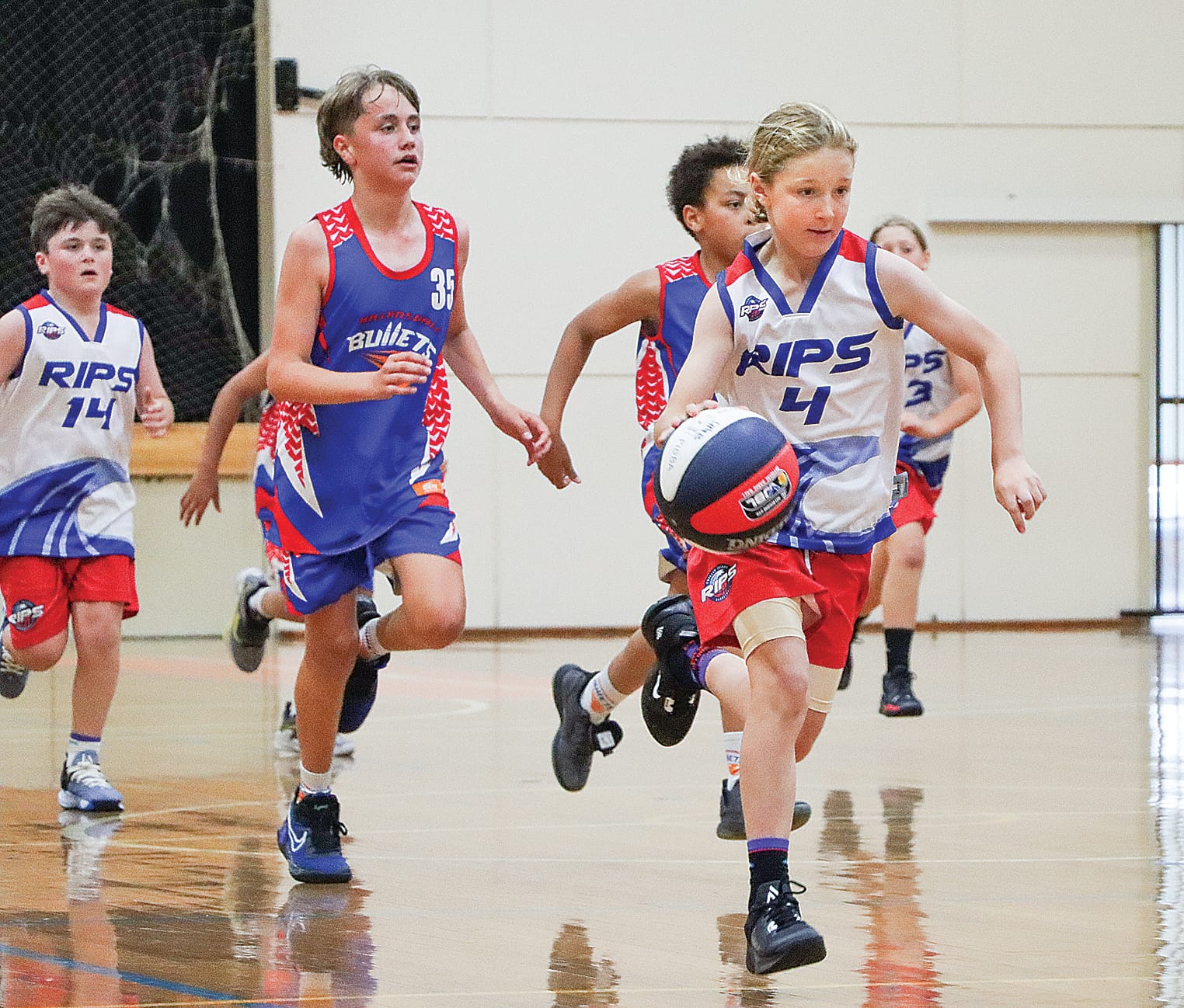 Jarrah Rutherford advances for Phillip Island in its under 14B stoush with Bairnsdale.