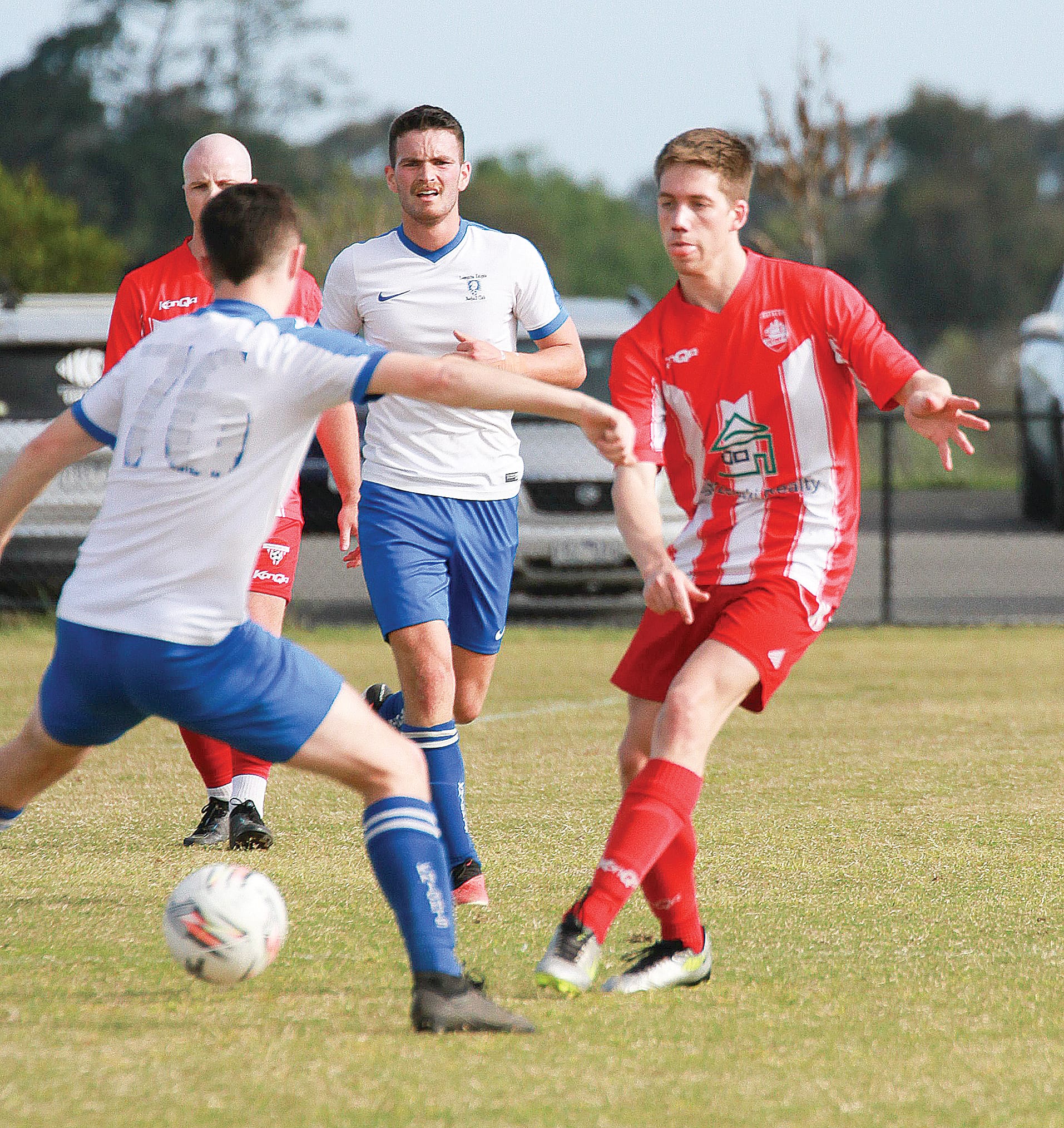 Leongatha’s Luke Knights protected the ball from Trafalgar’s Calvin Landy in the Senior Men’s grand final.