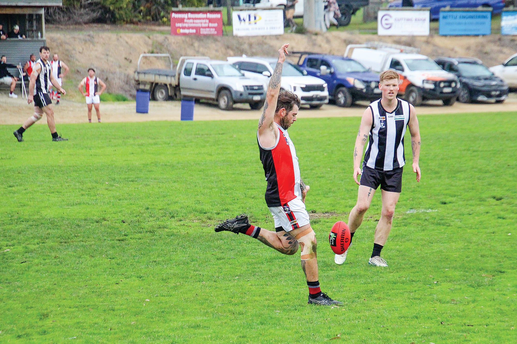 Seniors player Jordan Anderson boots the ball for Nyora.