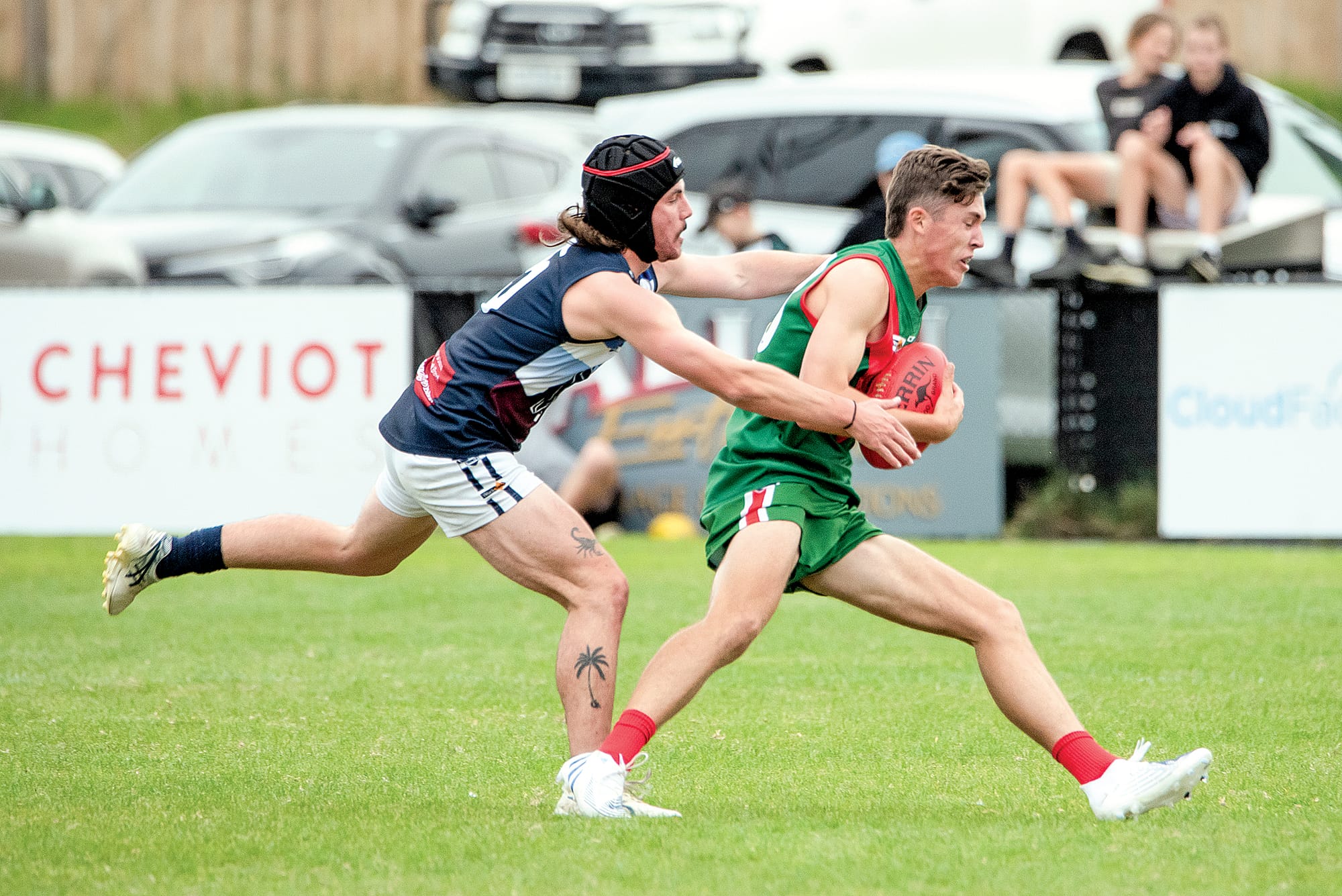 Kye Benson chases down his Tooradin opponent.