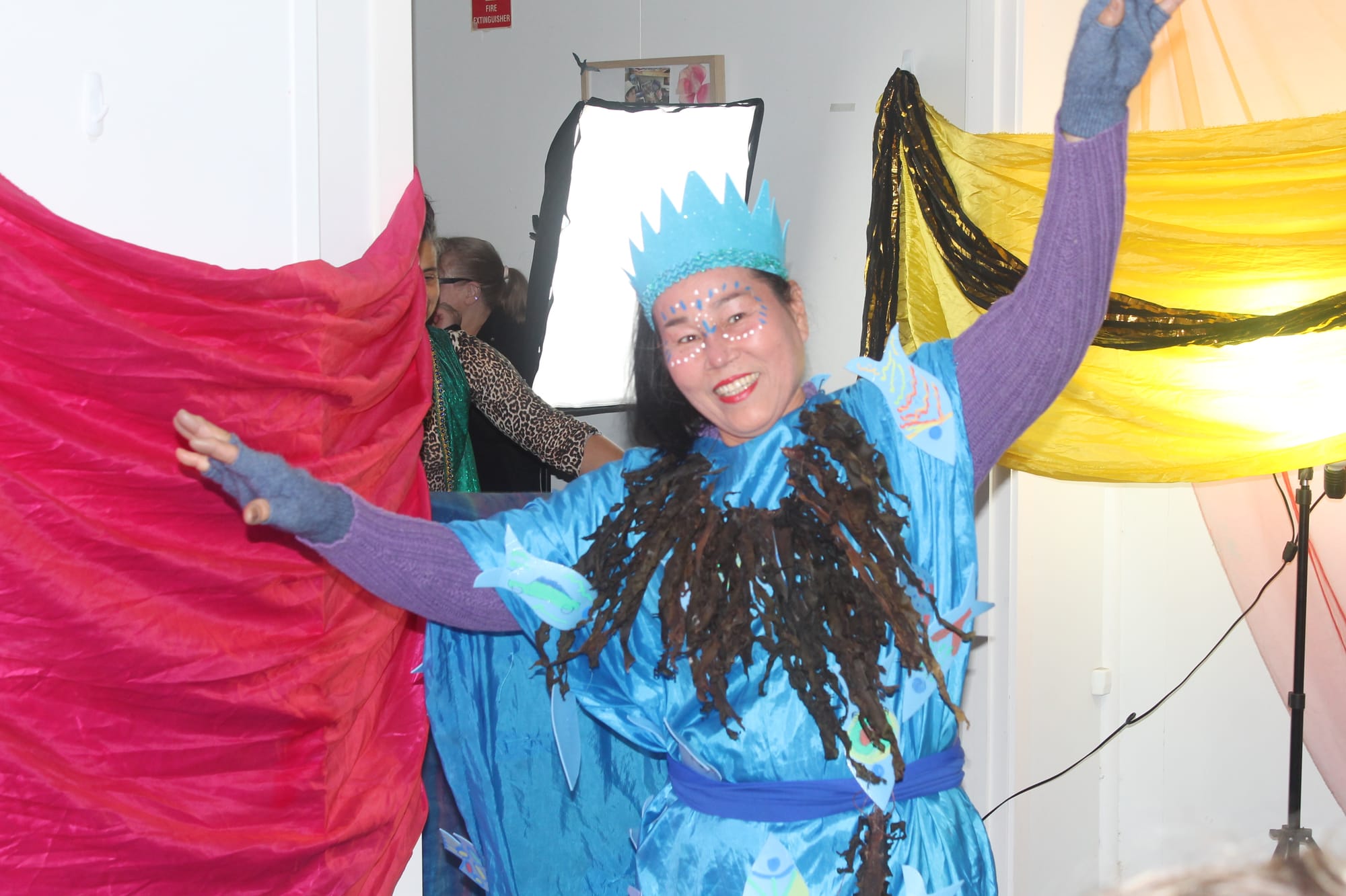 Migrant English Group member, Tuk, takes to the runway as the Queen of the sea, in a costume made from recyclable insulation. 
