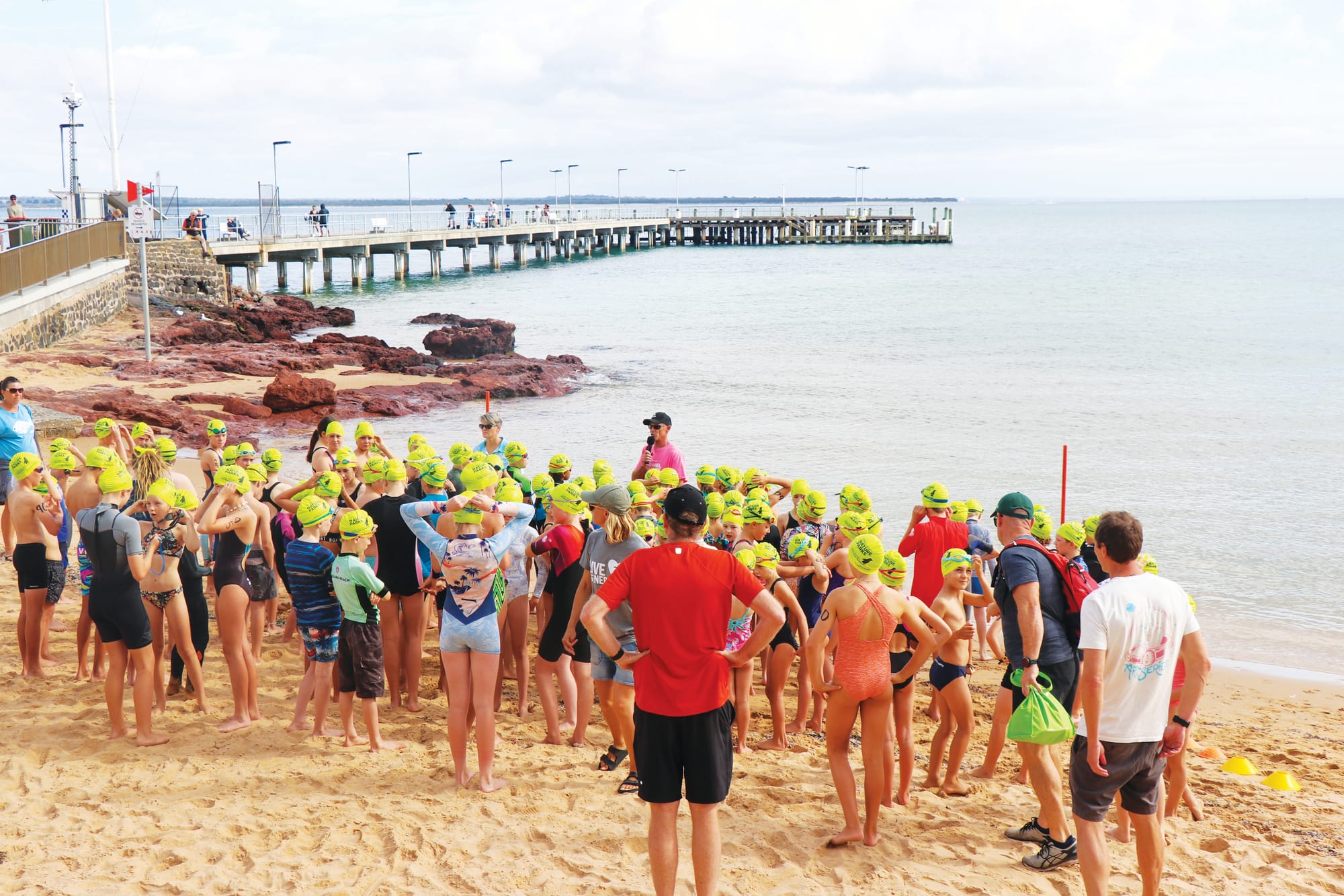 Participants of the junior beach biathlon for ages 7 to 14 were briefed on their course length before entering the water in their age groups. Z13_0823