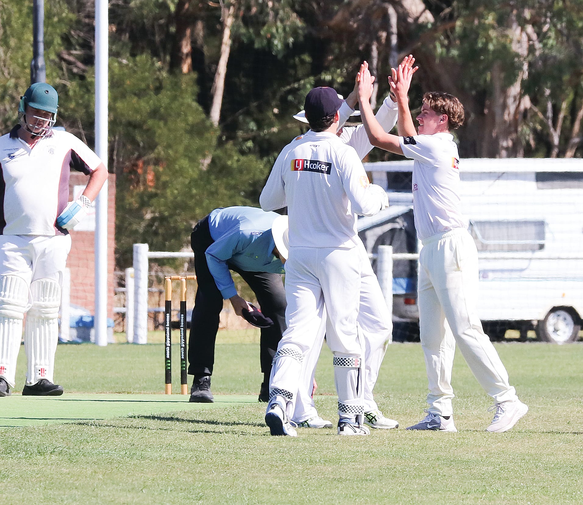 Jesse Dugard celebrates with his teammates. W15_1025