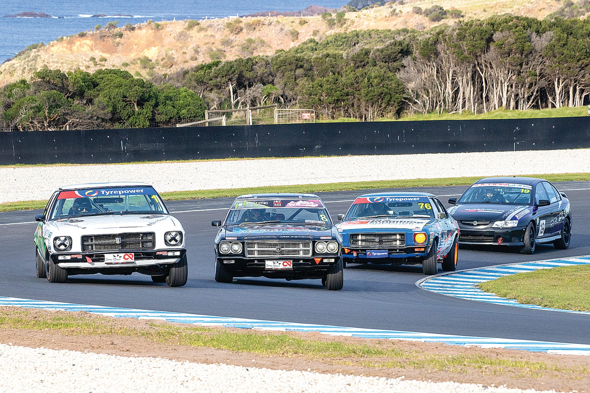The keenly contested HQ Holden class kept spectators enthralled as these beautifully turned-out classics strutted their stuff. Photo: Peter Cleeland.