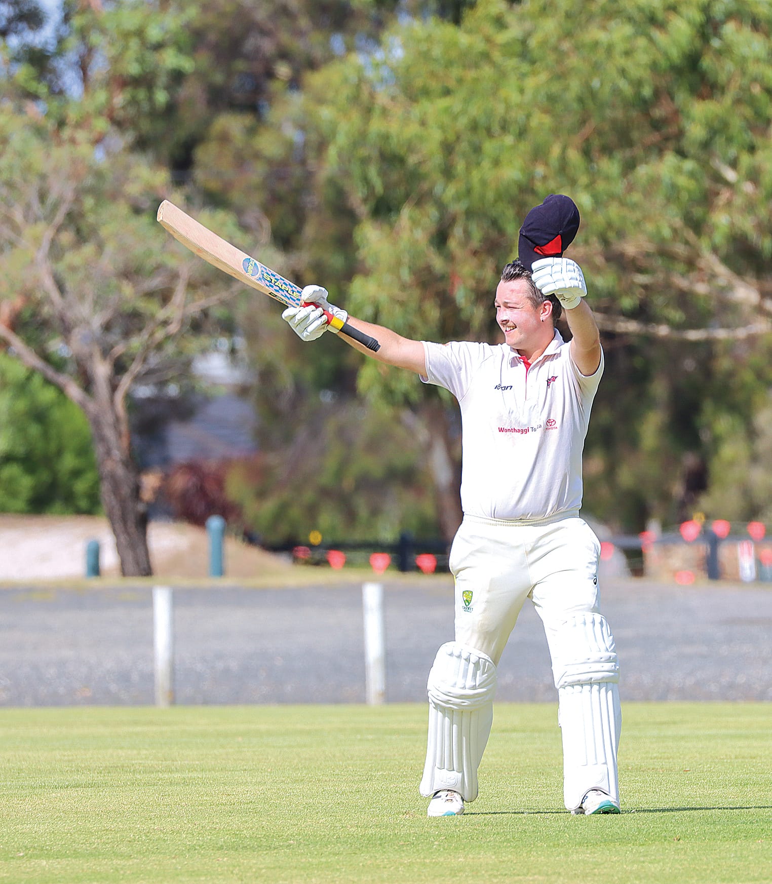 Callum Asbury acknowledges spectators after reaching his century for Inverloch in its A2 match against Kilcunda-Bass. A39_0825