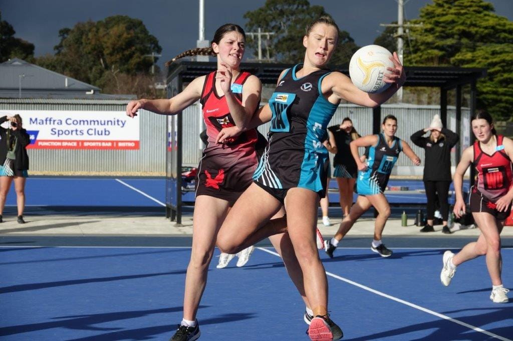 Wonthaggi A Grade Wing Attack Zahli Anderson hooks the ball in one handed under pressure from Maffra Goal Defence Chelsea Allman as Power puts its stamp on the game in the first half.