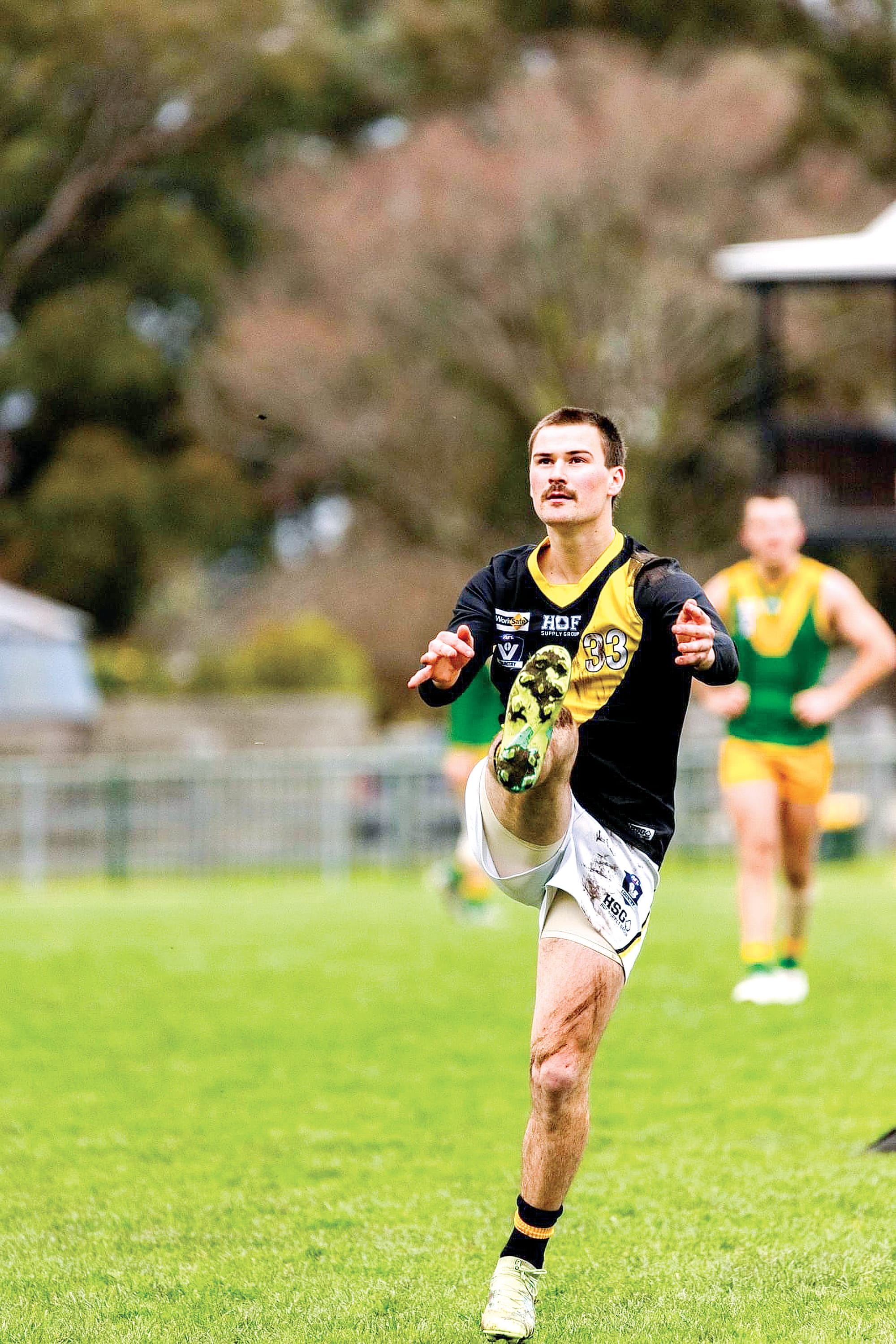 Mirboo North’s Rhys Kratzat launches the ball down the field. Photo: Annie Holland
