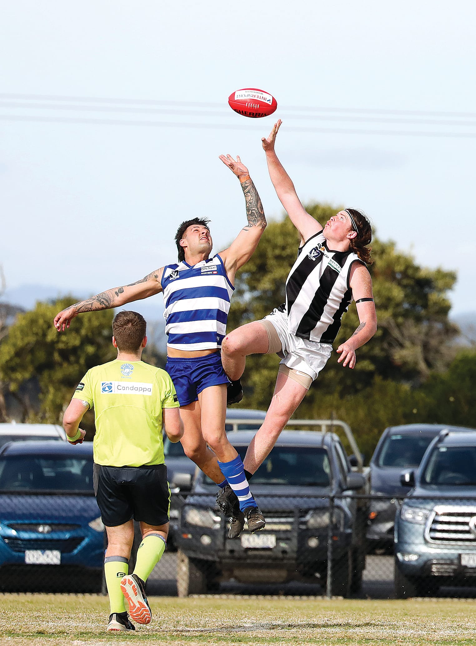 Poowong’s Mitch De Kleuver had hands to the ball ahead of his Neerim South opponent.
