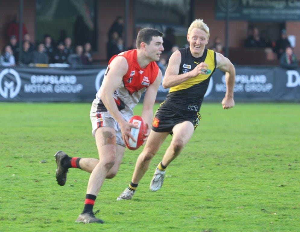 Warragul defender Patrick Mulqueen clears the ball forward as the Gulls make a late run at Morwell in the elimination final.